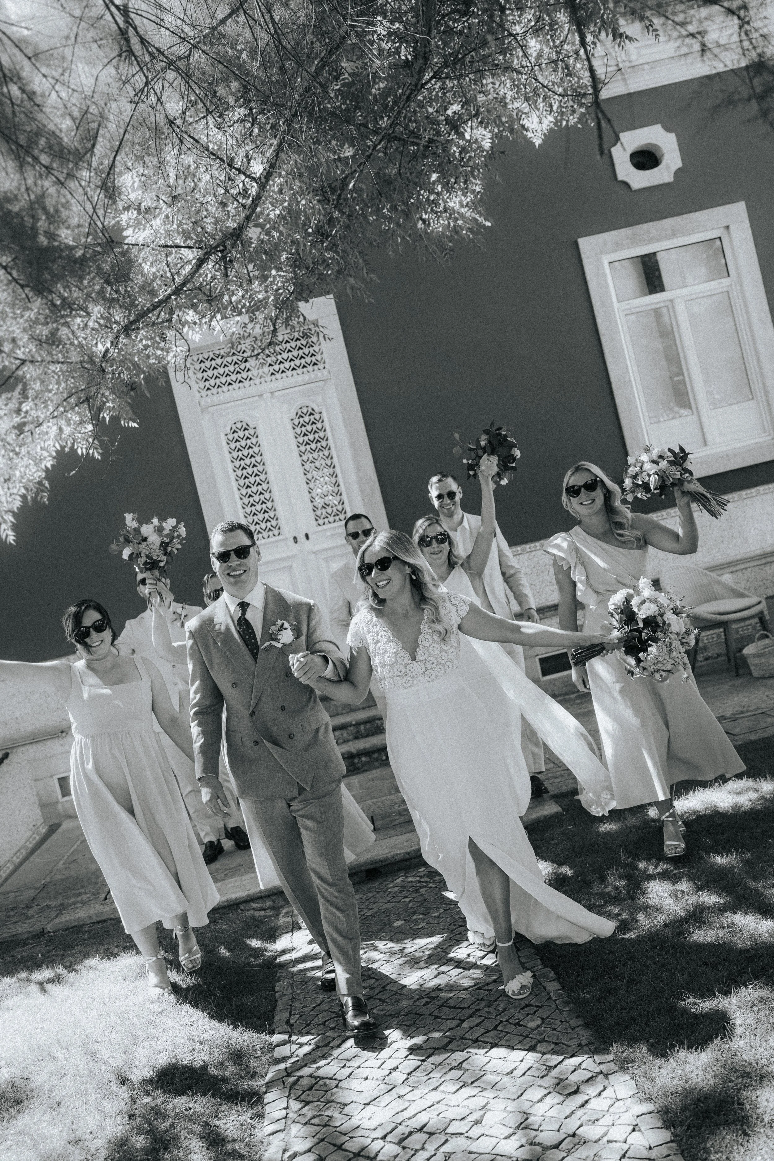 Bride and groom walking with bridesmaids and groomsmen at Os Agostos in the Algarve