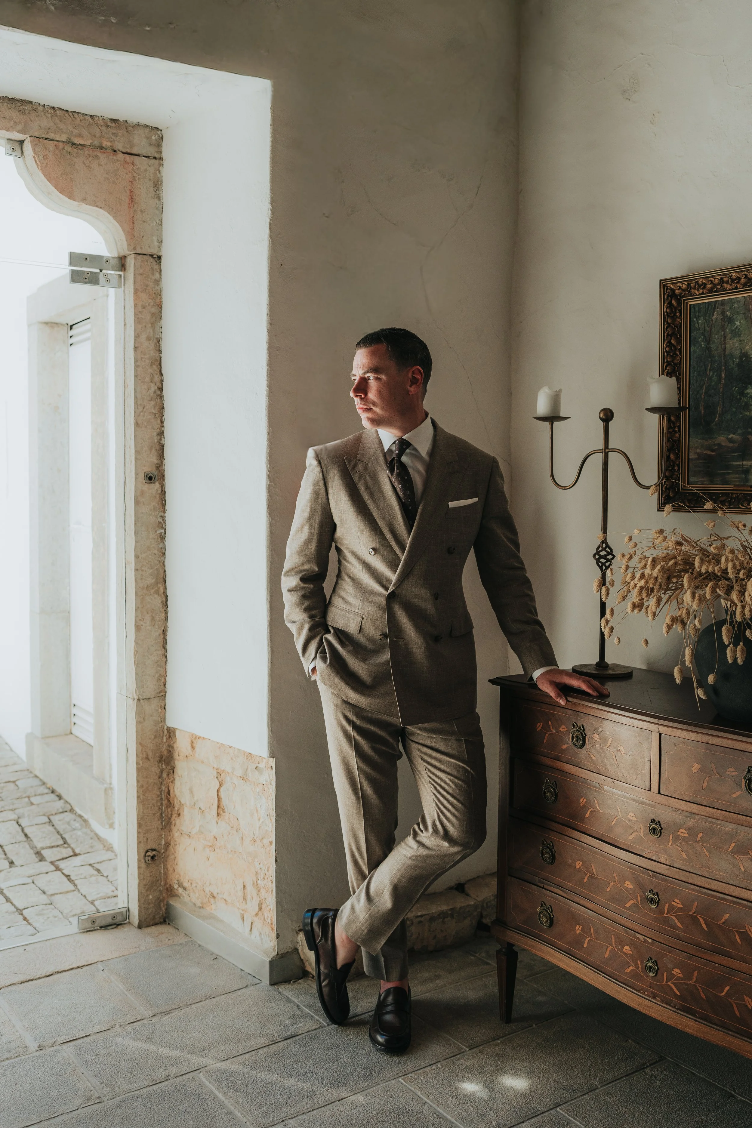 Groom portrait at Os Agostos wedding venue