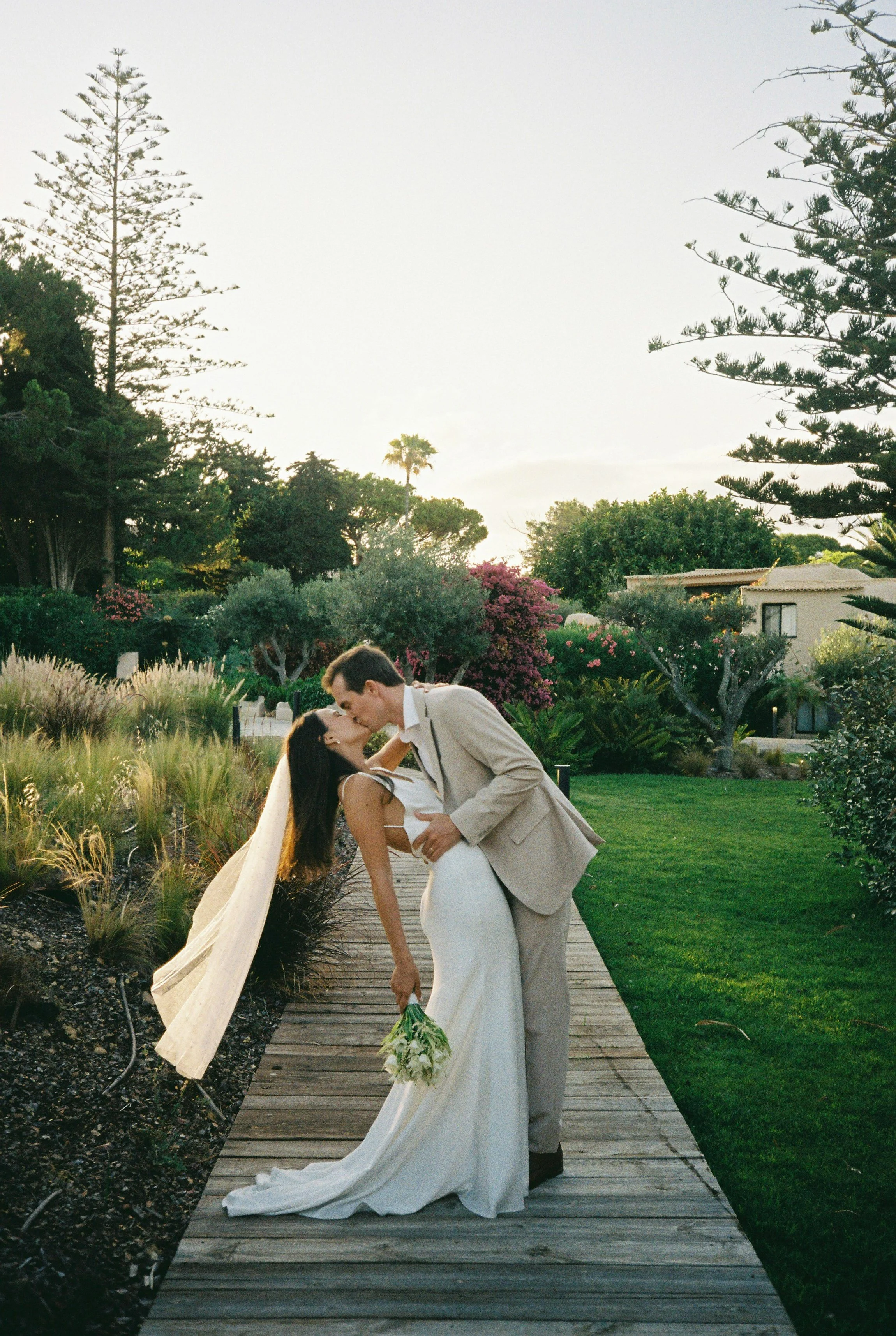 Analog wedding photo of a bride and groom kissing at Solar do Paço in the Algarve