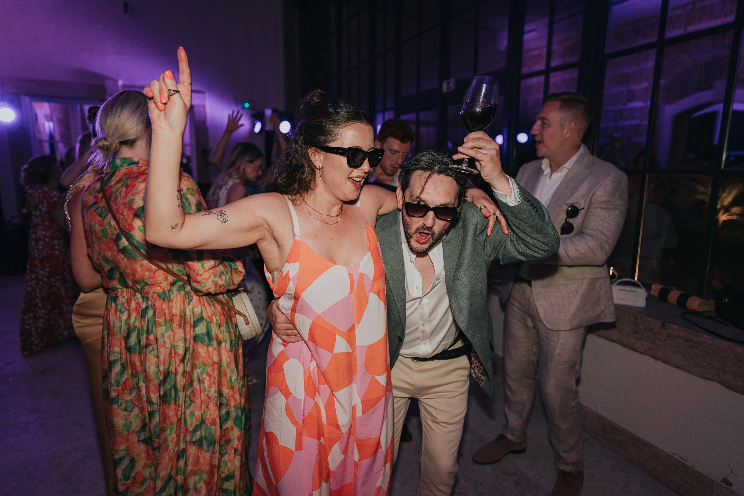 Wedding guests dancing at Vandelli Botanical Garden in Lisbon, Portugal