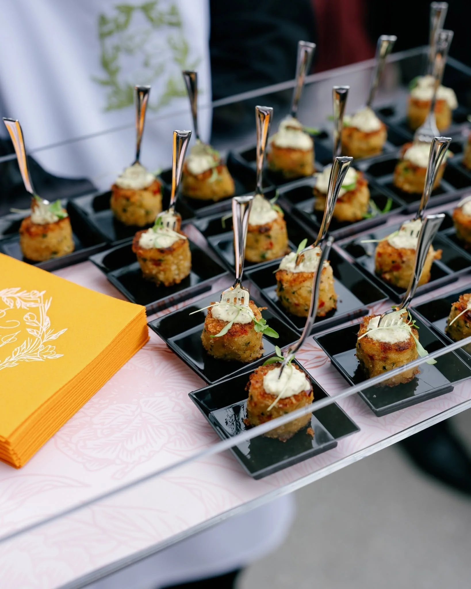 Catered appetizer display by City Catering in Knoxville featuring individually plated bite-sized hors d’oeuvres with elegant presentation for a special event.