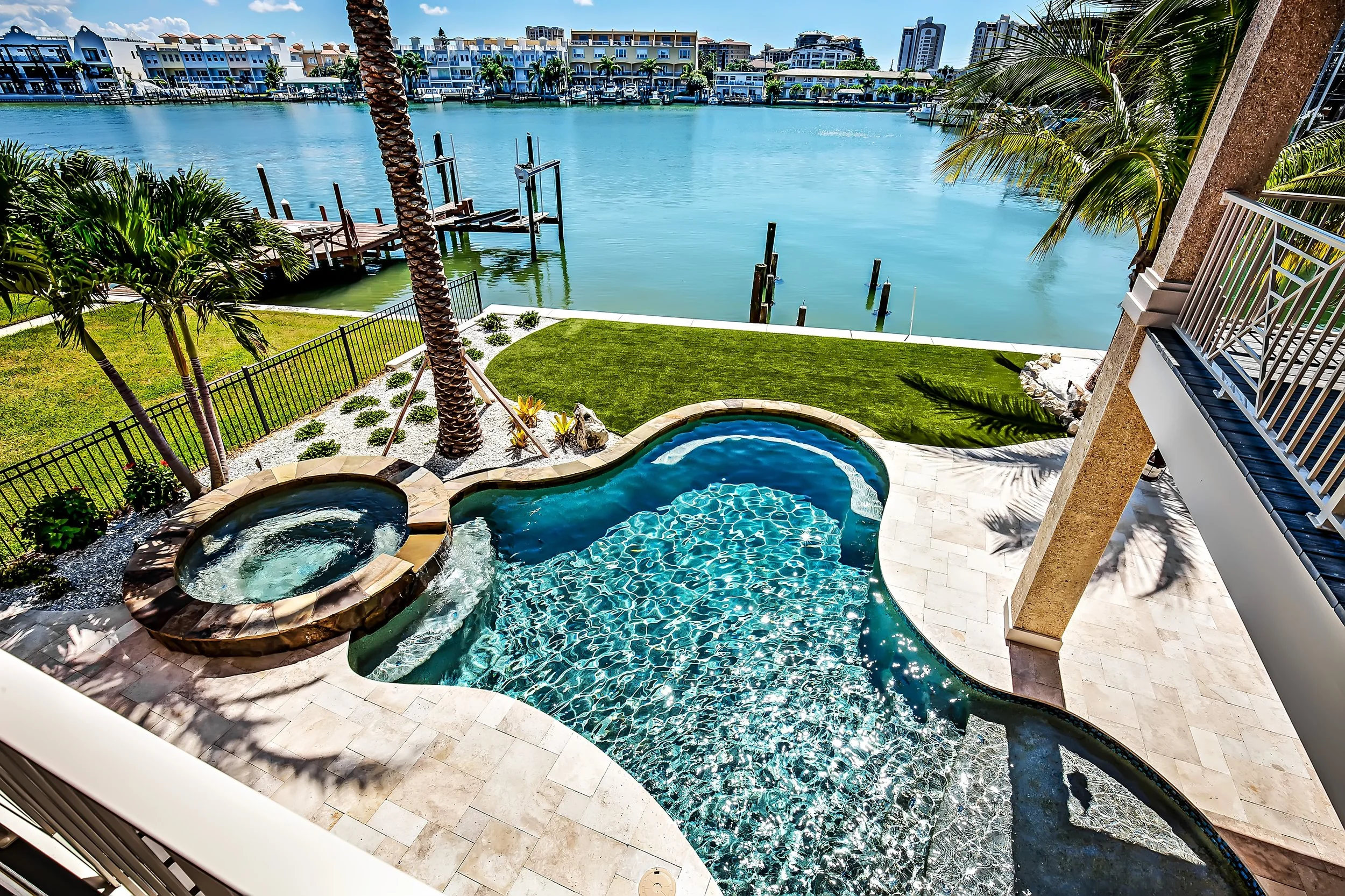 curved pool, waterfront property | Lindross Remodeling