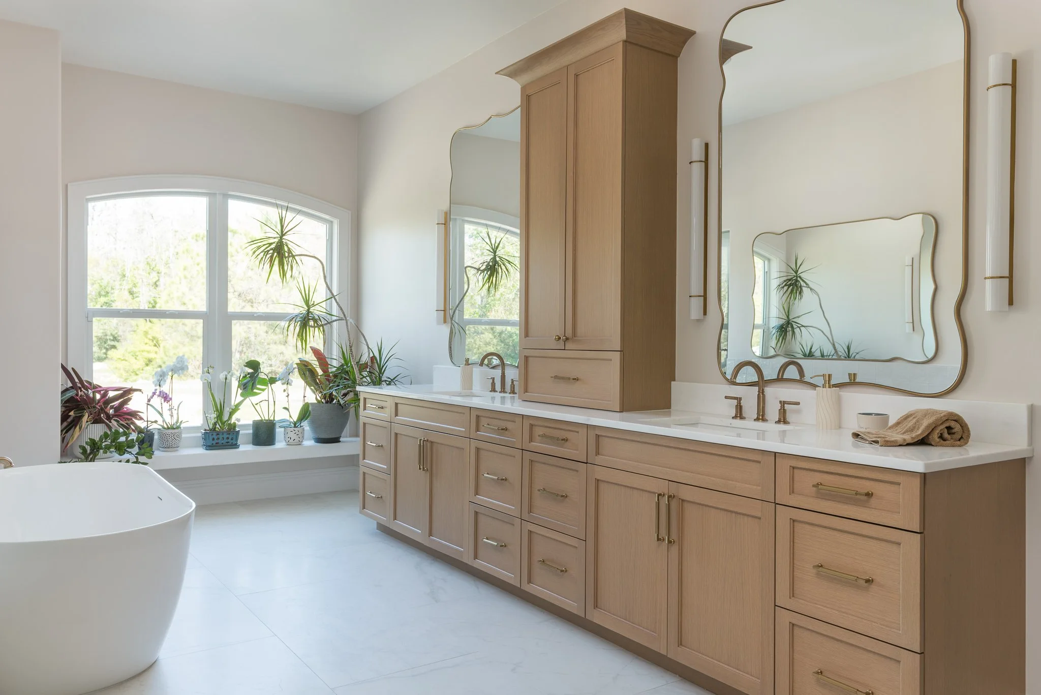 white oak double bathroom vanity in a chic bathroom in Tarpon Springs Fl