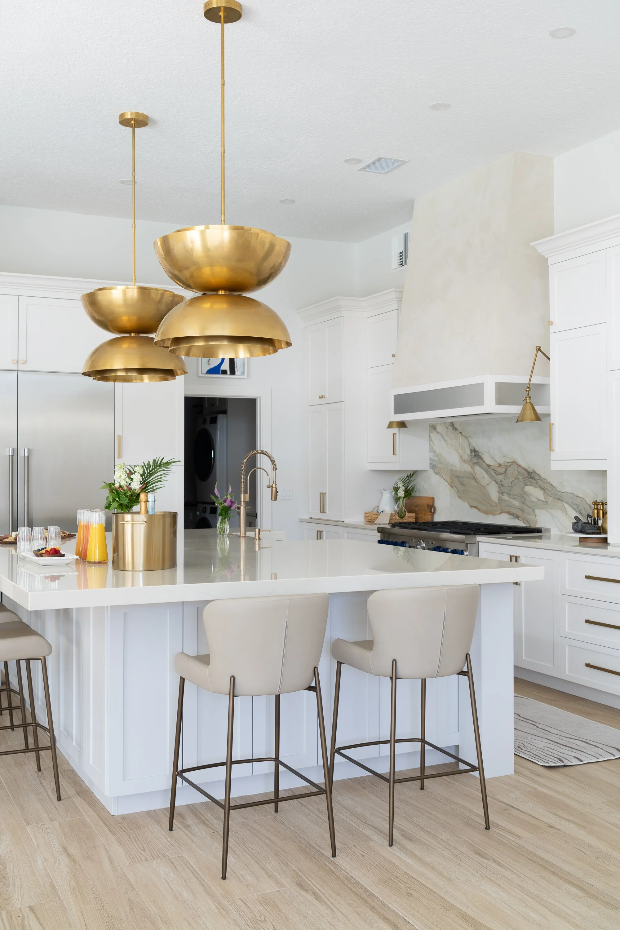 beautiful custom kitchen by Lindross Remodeling with a plaster range hood with a metal band