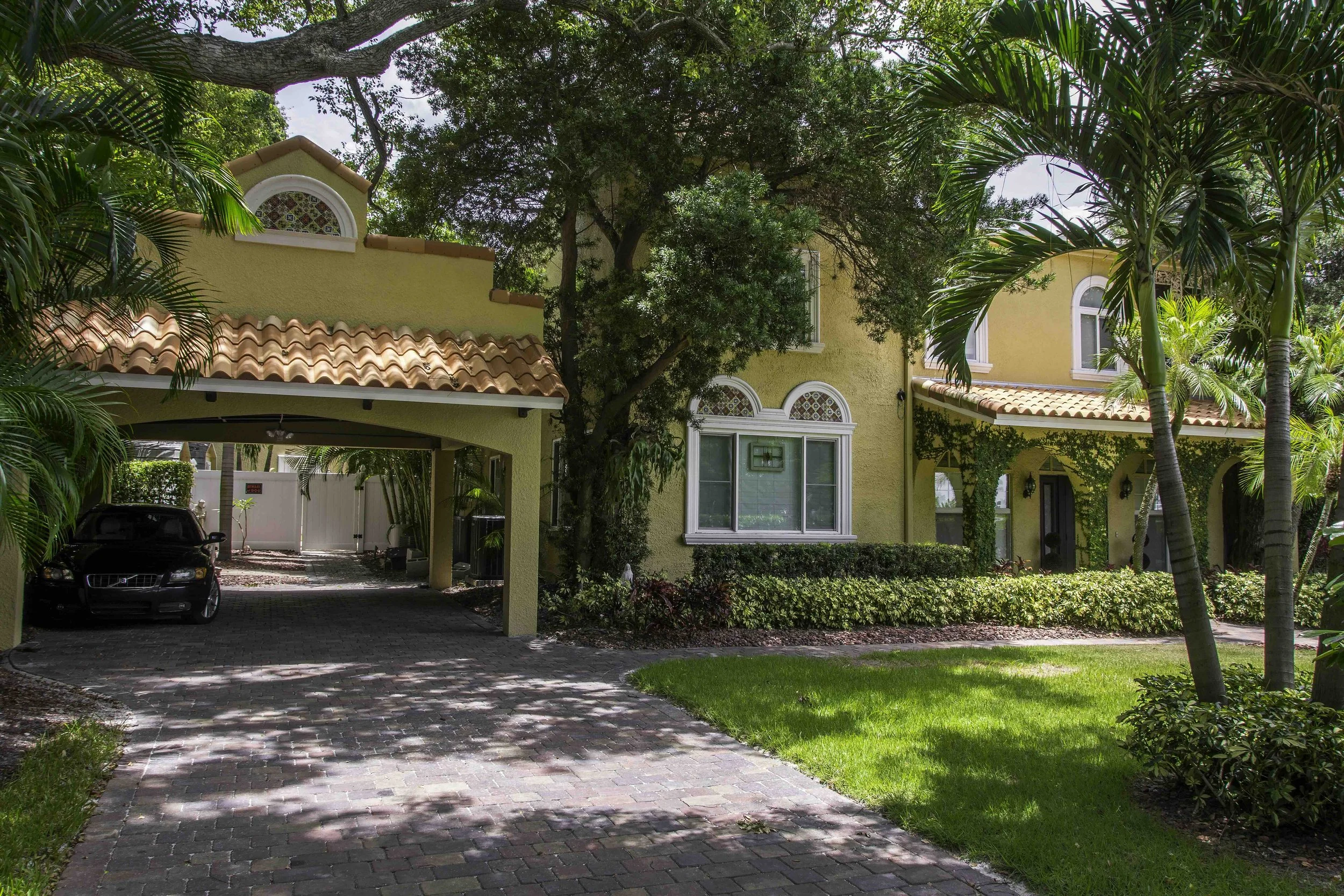 a beautiful Spanish Style Carport as a part of Spanish Mediterranean style home in South Tampa