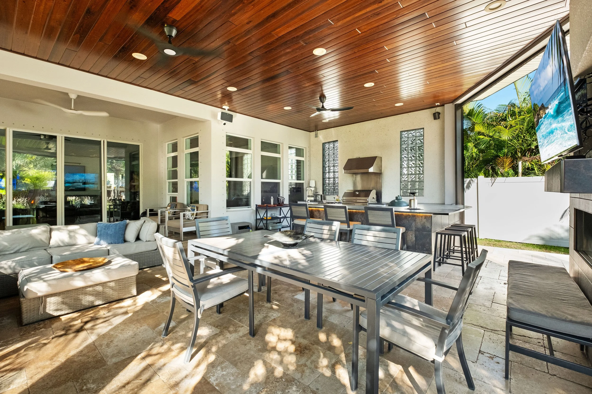 a photo of a Backyard Covered Patio with multiple seating areas in south tempa, florida | lindross remodeling