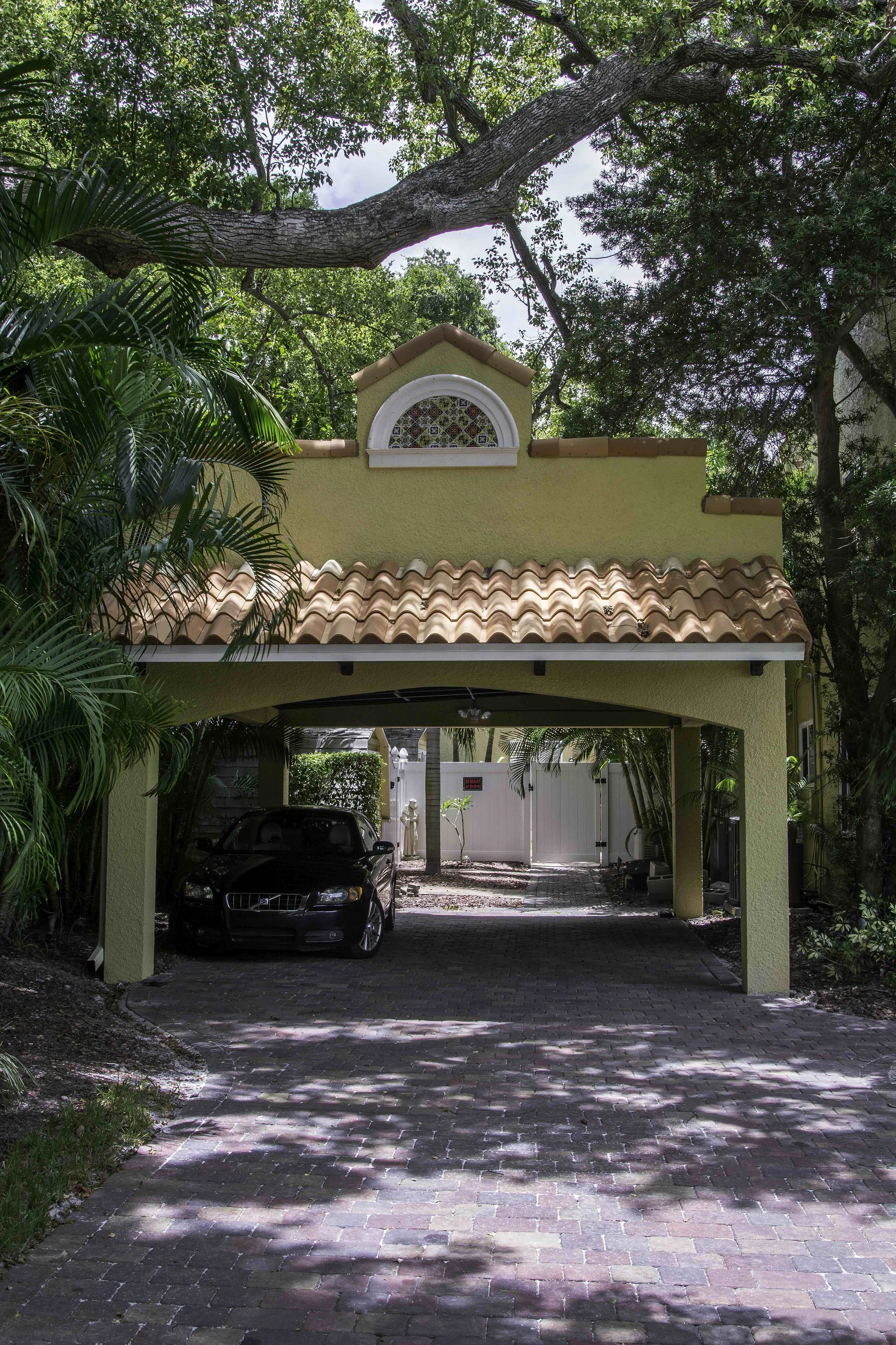 red tile roof, stucco siding on a The stucco exterior is one of the most recognizable features of a Spanish style carport