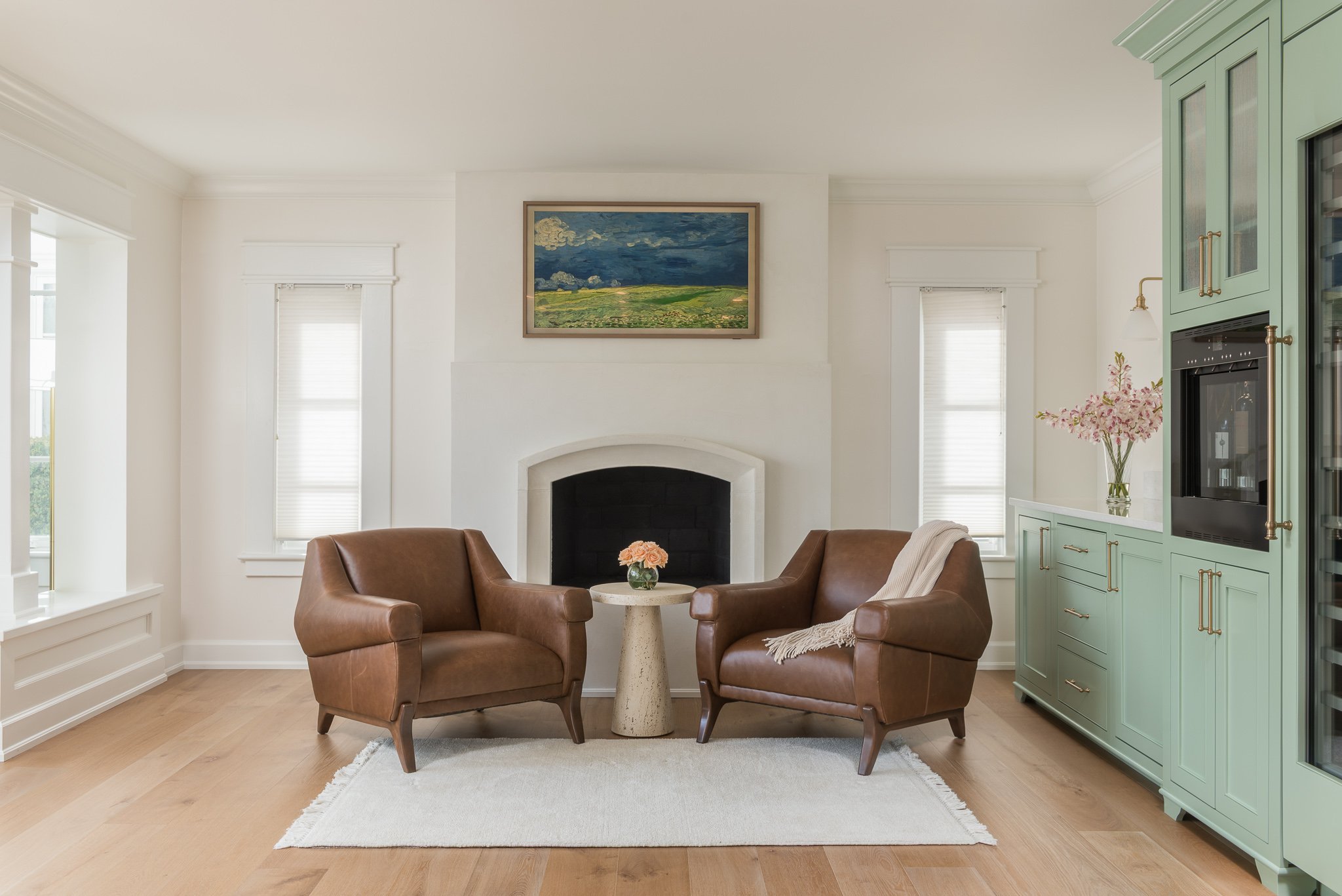 this large living room with a symmetrical fireplace centered between two windows was also a part of the full home renovation in South Tampa