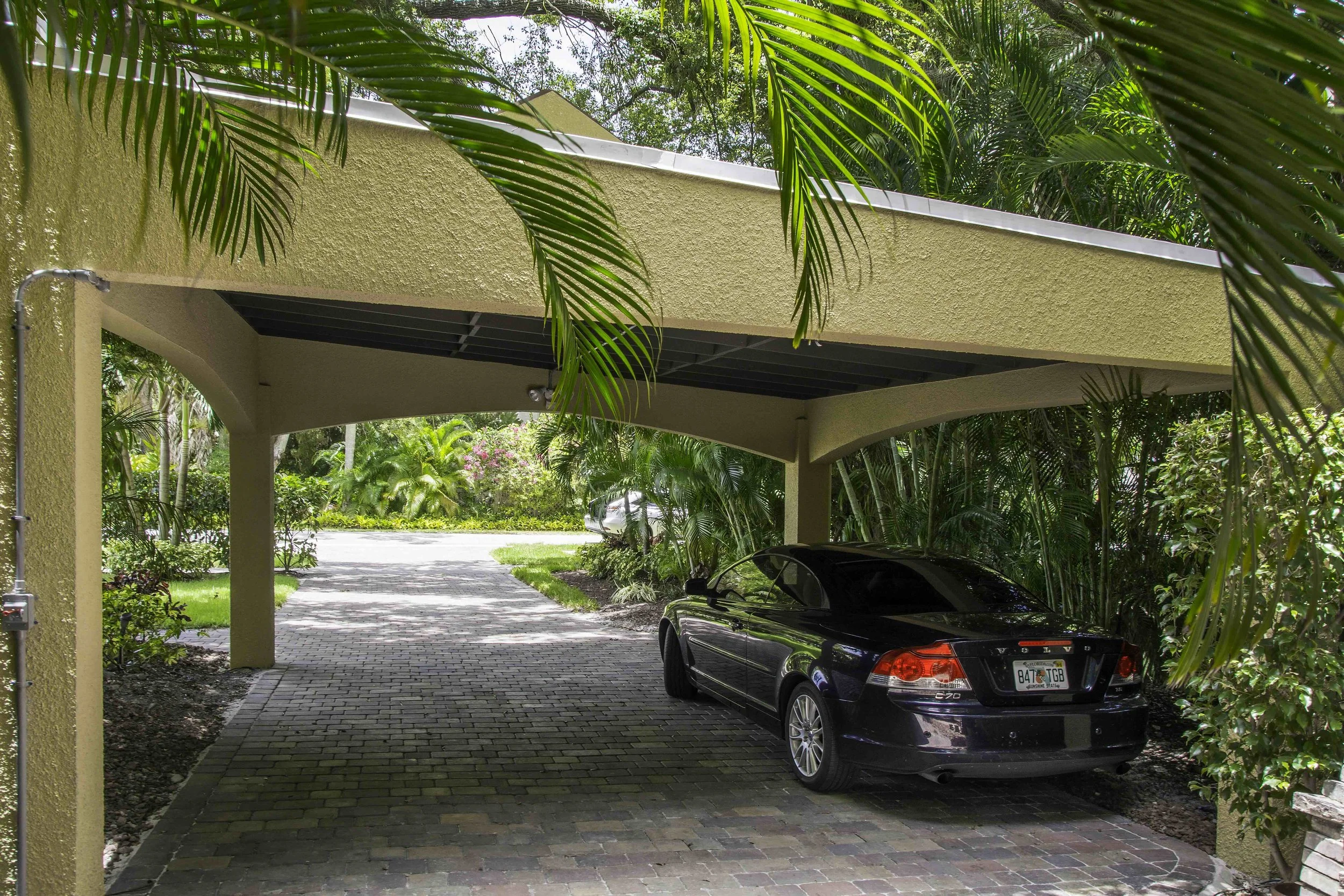 close-up of a The stucco exterior is one of the most recognizable features of a Spanish style carport in South Tampa