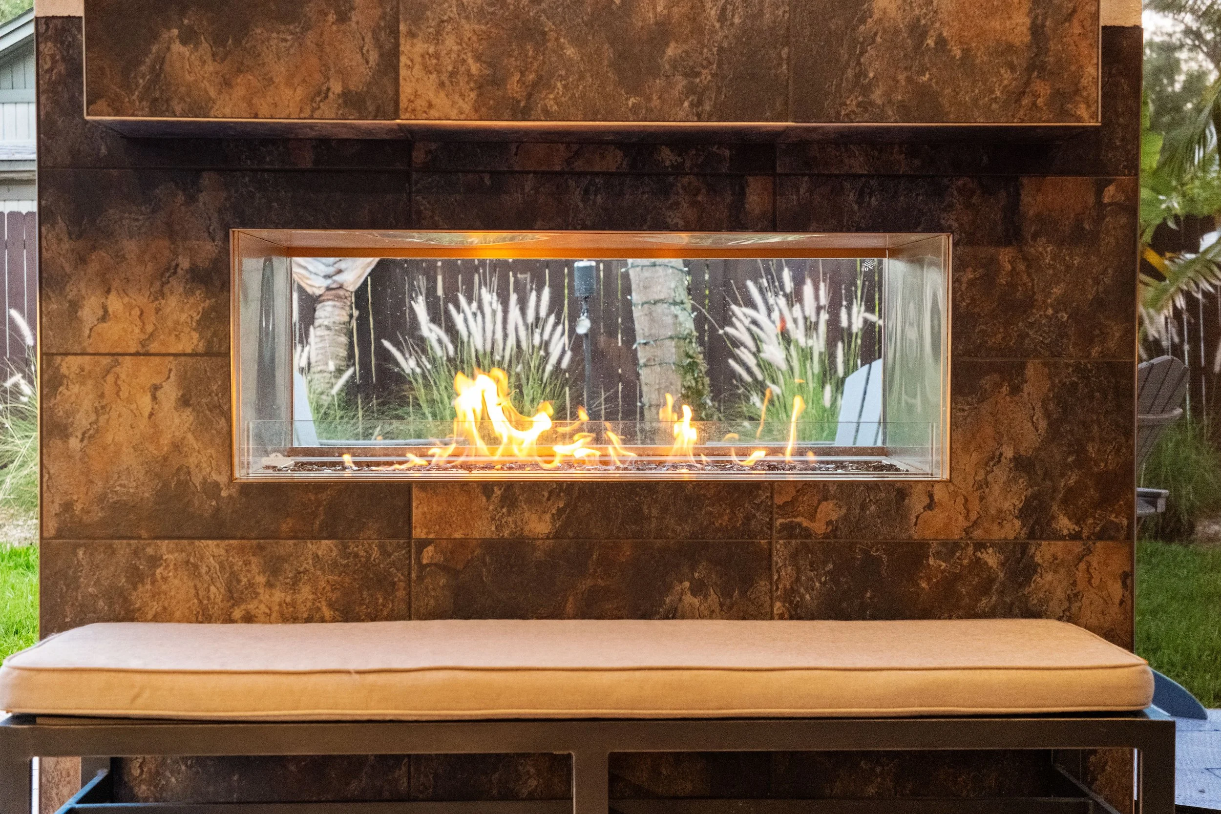 custom Napoleon fireplace at a Backyard Covered Patio
