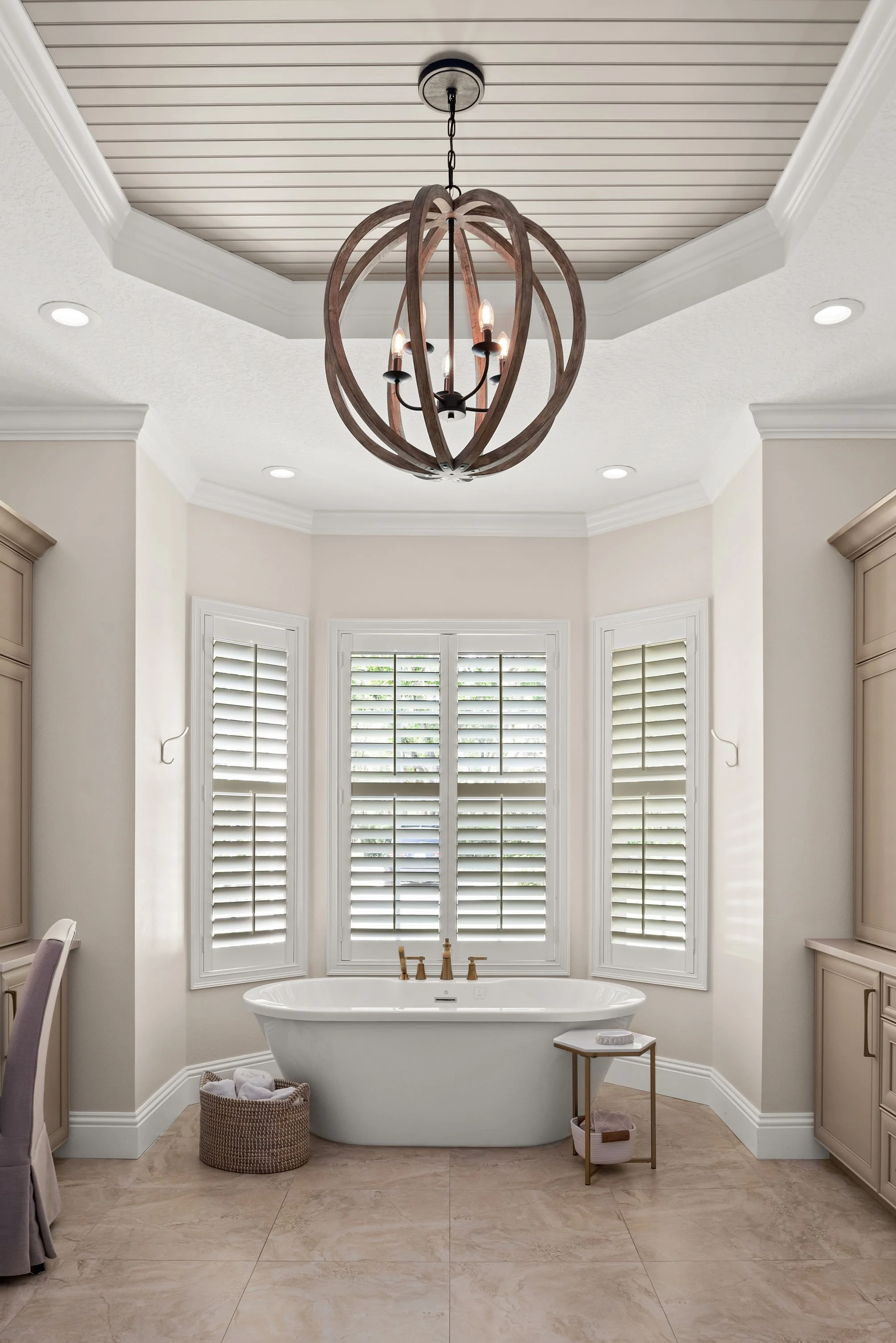 Primary bathroom by Lindross Remodeling that features a Freestanding Tub, Bay Window, and Octagon Tray Ceiling