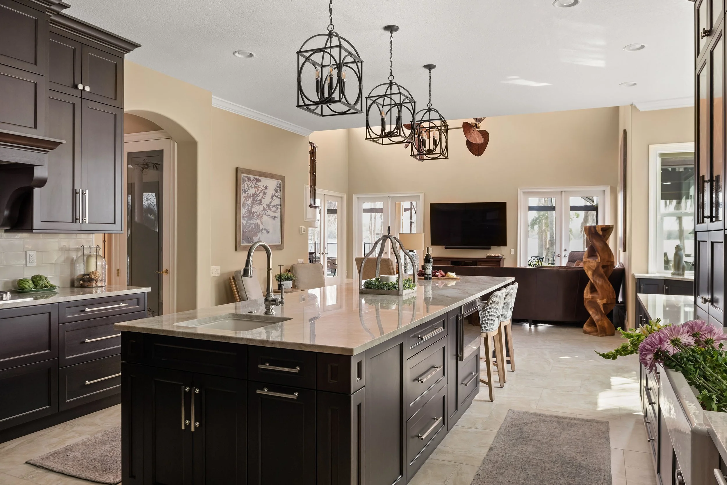 sink at the end of the island of a custom kitchen by Lindross Remodling