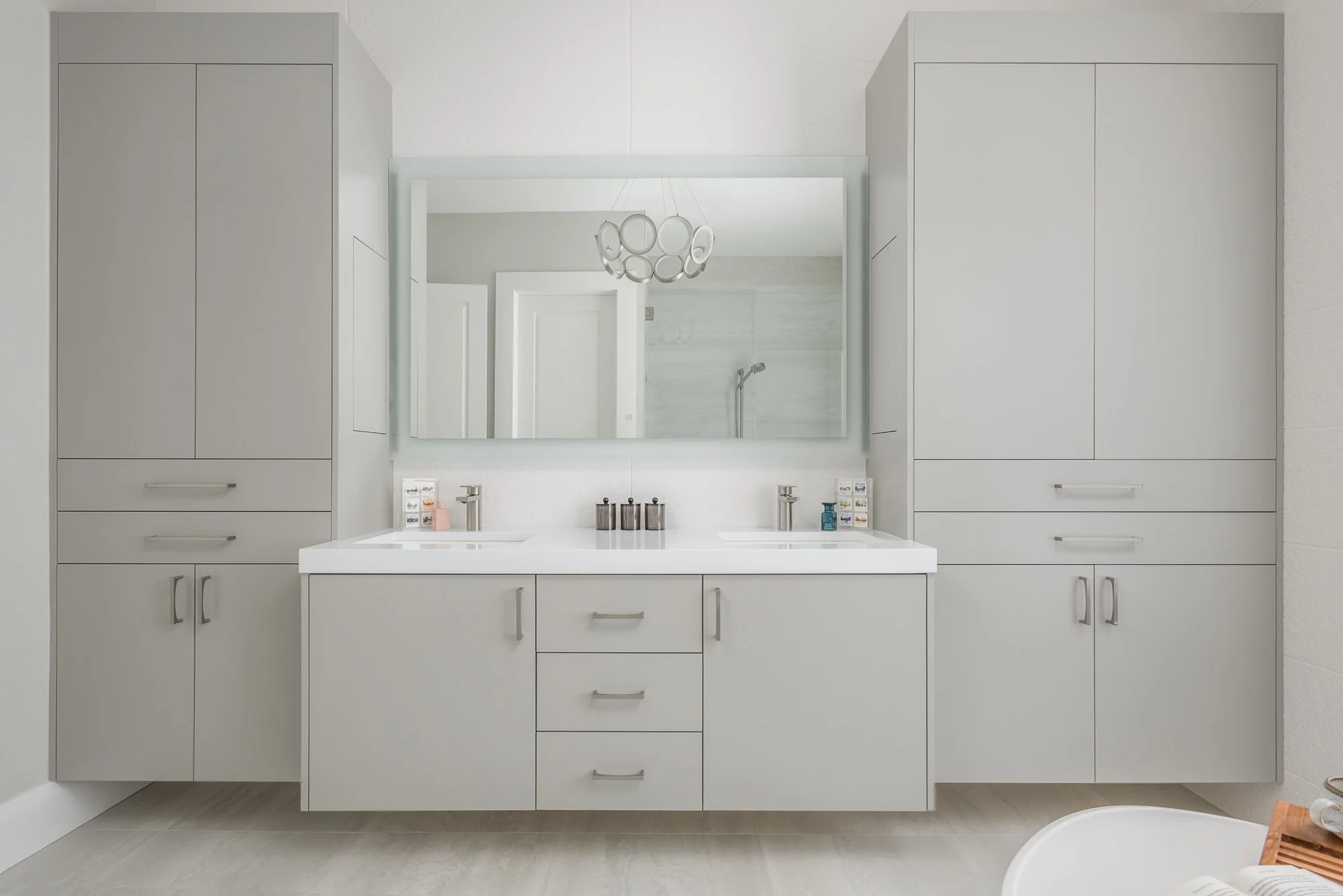 The two sinks on this double bathroom vanity in a custom bathroom by Lindross remodeling