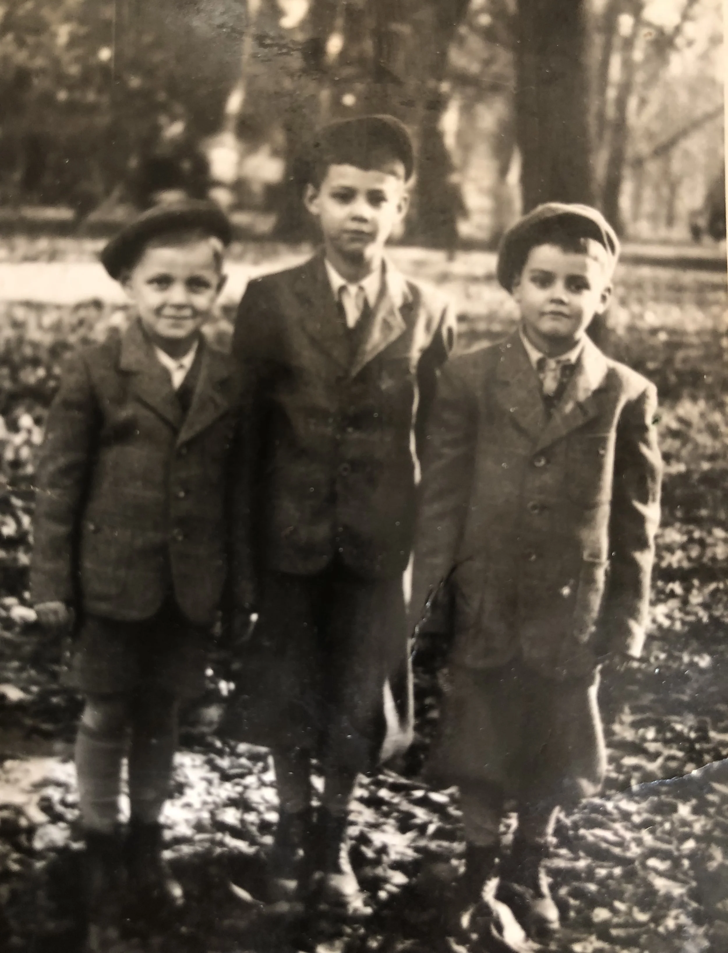George (far right) with brothers Robert (far left) and Jehuda