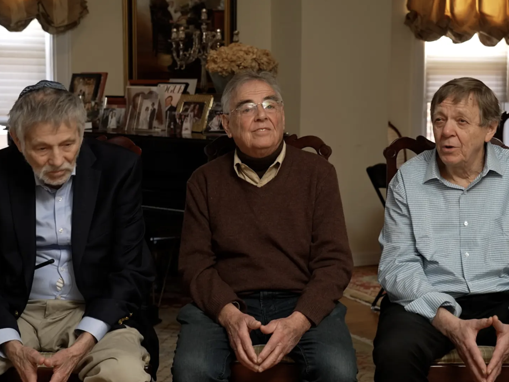 George with brothers Jehuda (left) and Robert, 2023