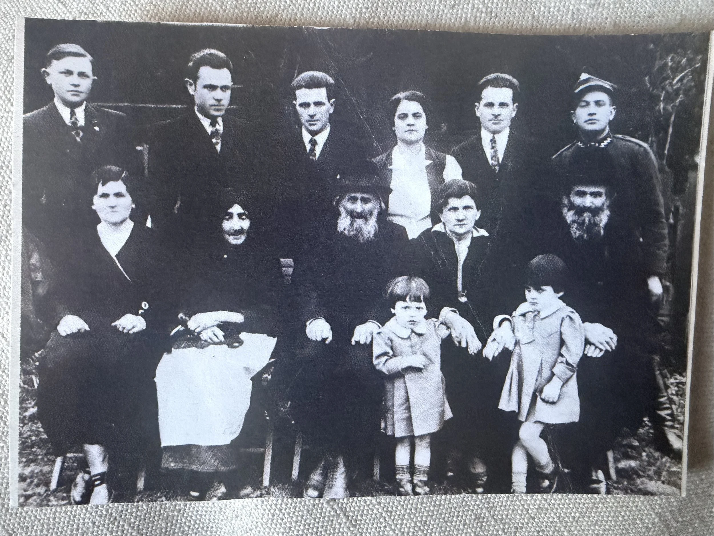  Family photo taken before Sally’s uncle, Nehemia (“Nat”) Engelberg (rear, third from left) emigrated to the United States in 1938. Among those pictured with him are Sally (front right), her sister Miriam (front left), their parents, Tsivia and Leibs