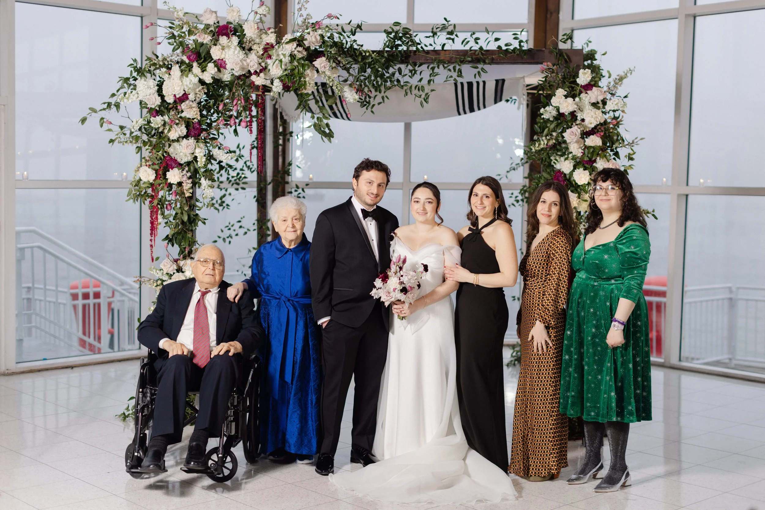 Sally and Kenneth Frischberg (far left) with their grandchildren, Lee and Fanny Wolfowitz (flanking the bride) and Hannah and Bernie Frischberg (far right), at Lee's wedding to Lucie Felder, 2025