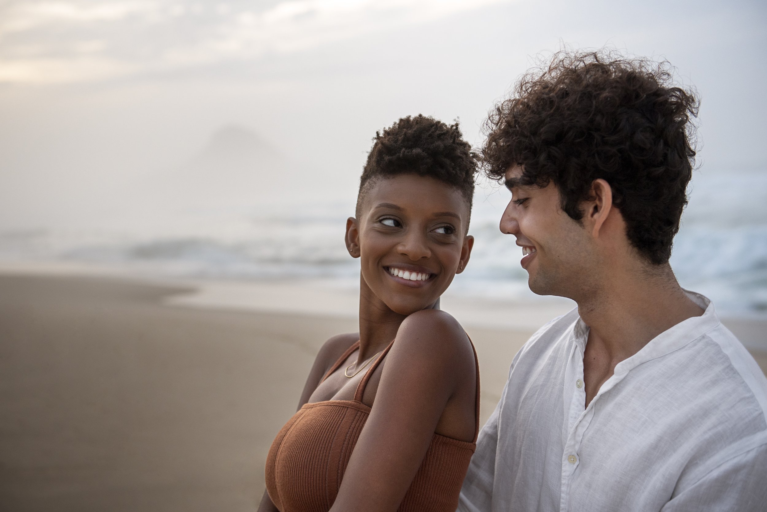 beautiful-couple-showing-affection-beach-near-ocean.jpg