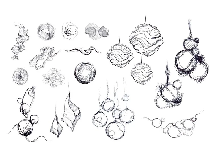 Sketch of various holiday ornaments and decorations, including hanging balls, abstract shapes, and decorative elements.