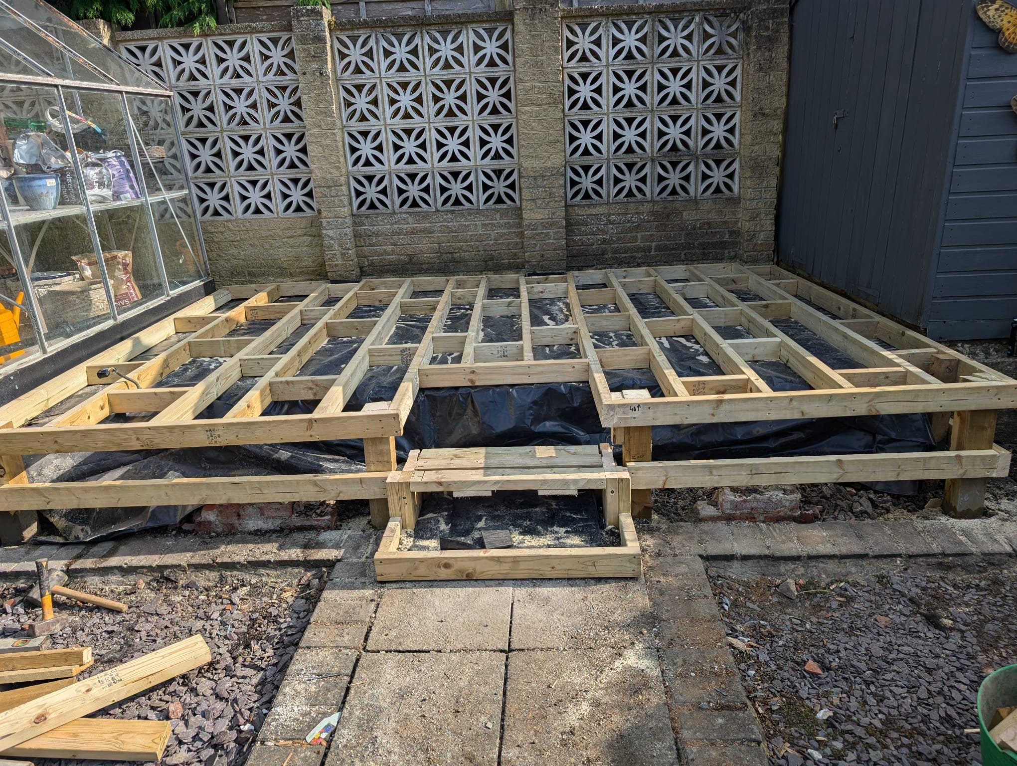 With the area cleared, we installed a strong timber frame as the base for the new deck. Before construction, we added a damp-proof membrane to protect the frame from moisture and prevent rotting, ensuring long-term durability. This timber structure p