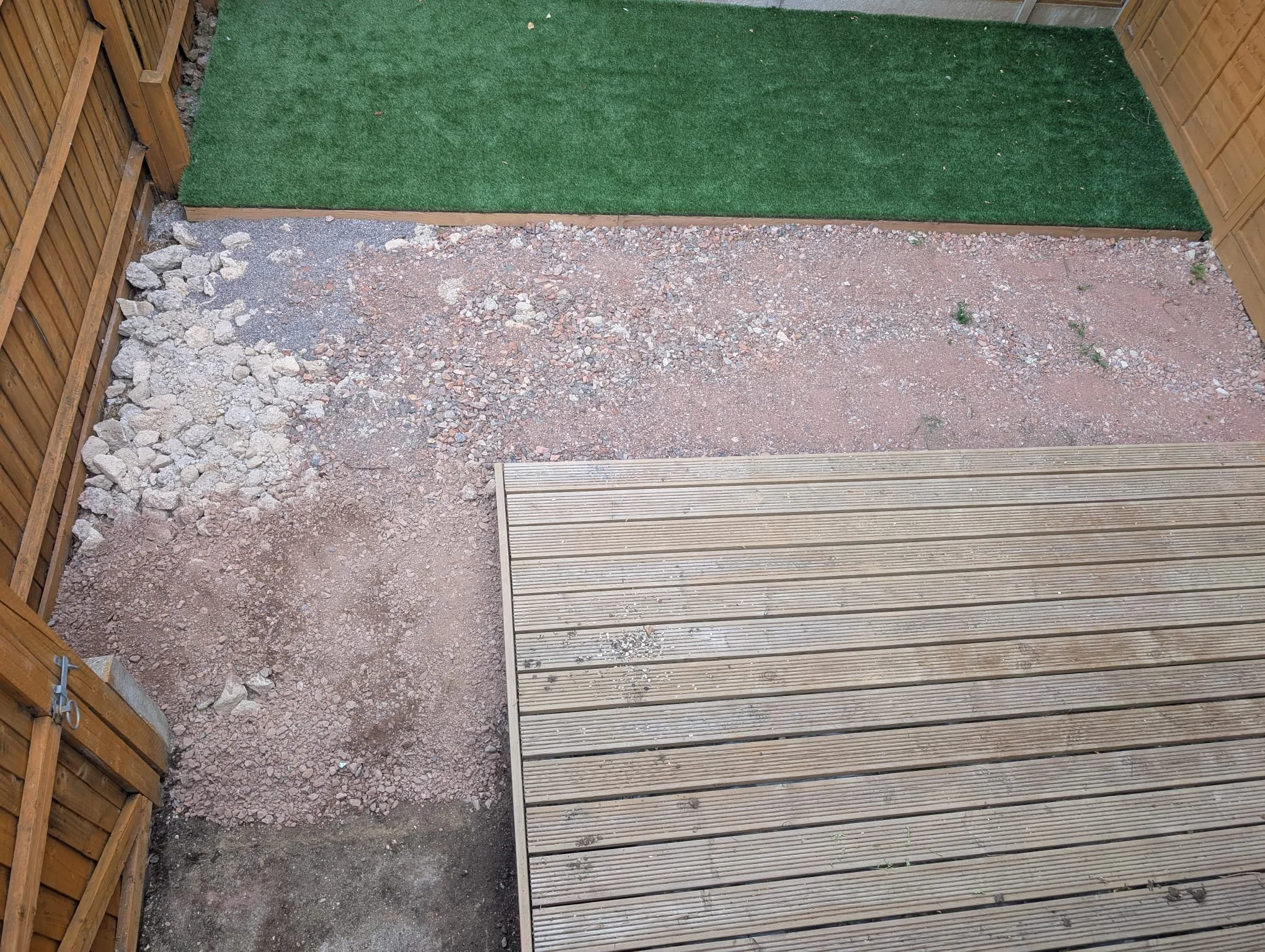 With the turf in place, the remaining areas were prepared for paving. The hardcore was levelled and compacted, setting the stage for a seamless slab installation.