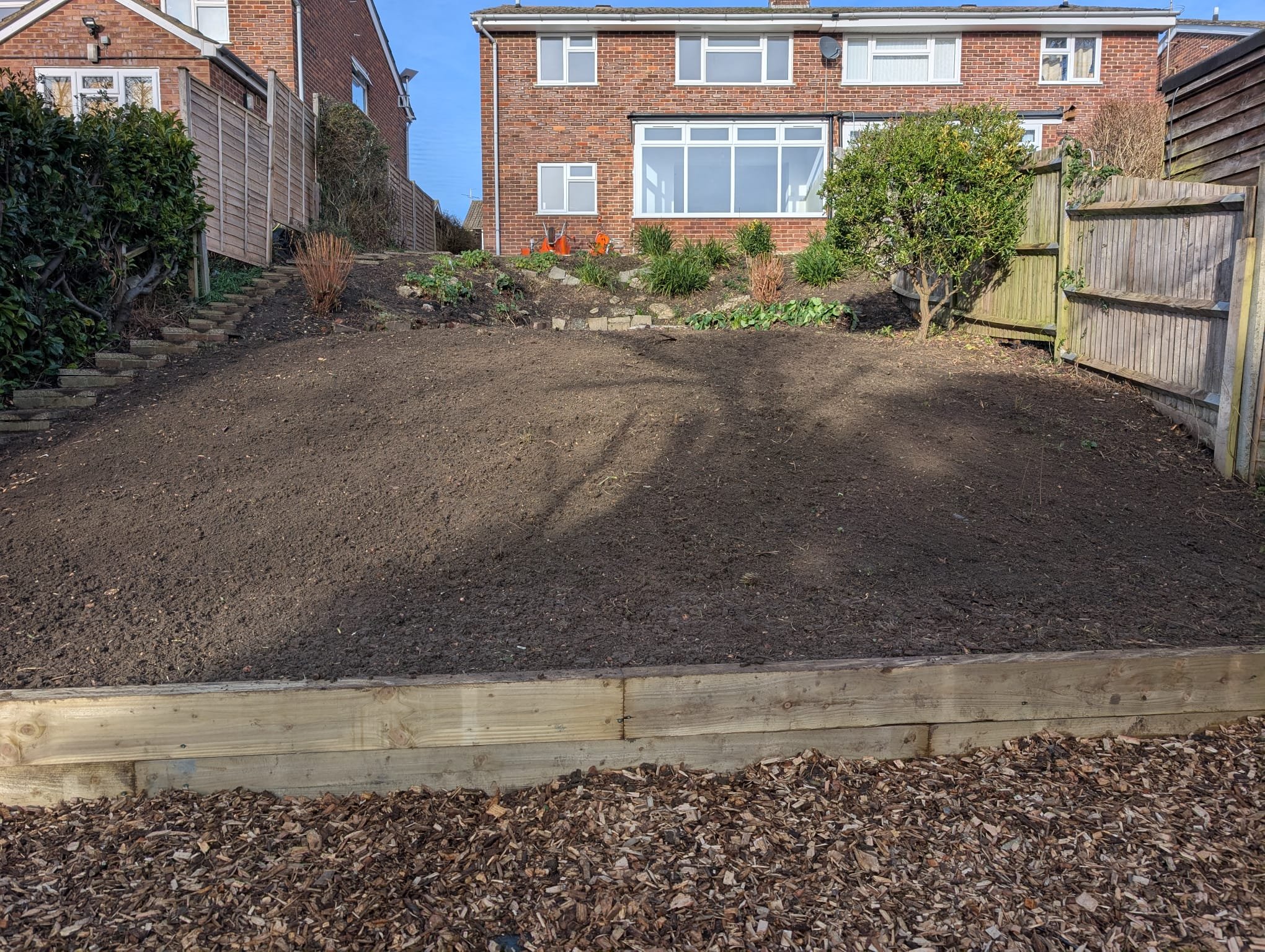 With the main structure in place, the upper section of the garden was carefully levelled and prepared. This groundwork was essential to ensure proper drainage and a smooth, even surface ahead of turf installation. The bottom area of the garden was fu