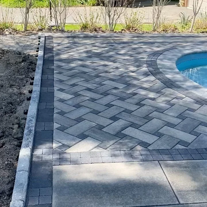 Here&rsquo;s a pool project we completed this spring featuring a basket weave using @techobloc #blu60 &amp; #squadra. Stay tuned for pictures of the landscaping