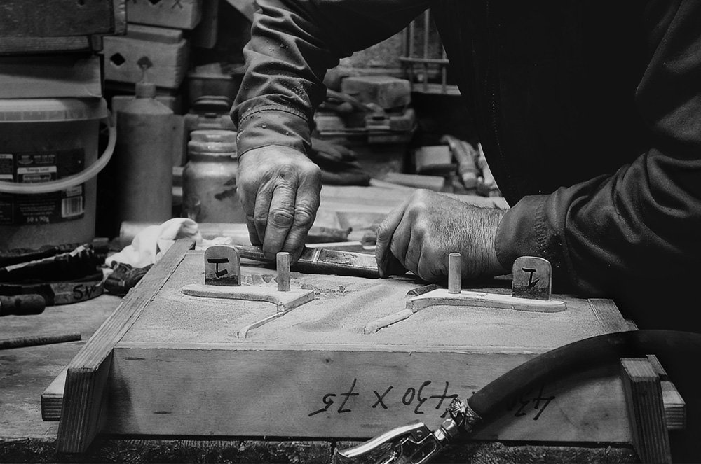 Traditional iron casting process in action.