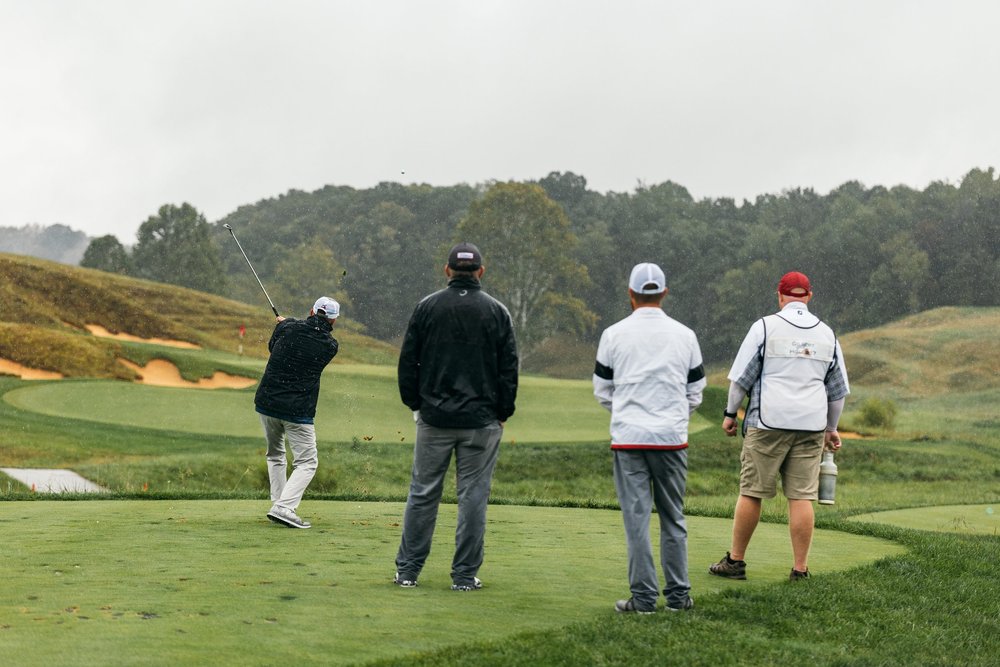 Three golfers playing on a course. (Copy)