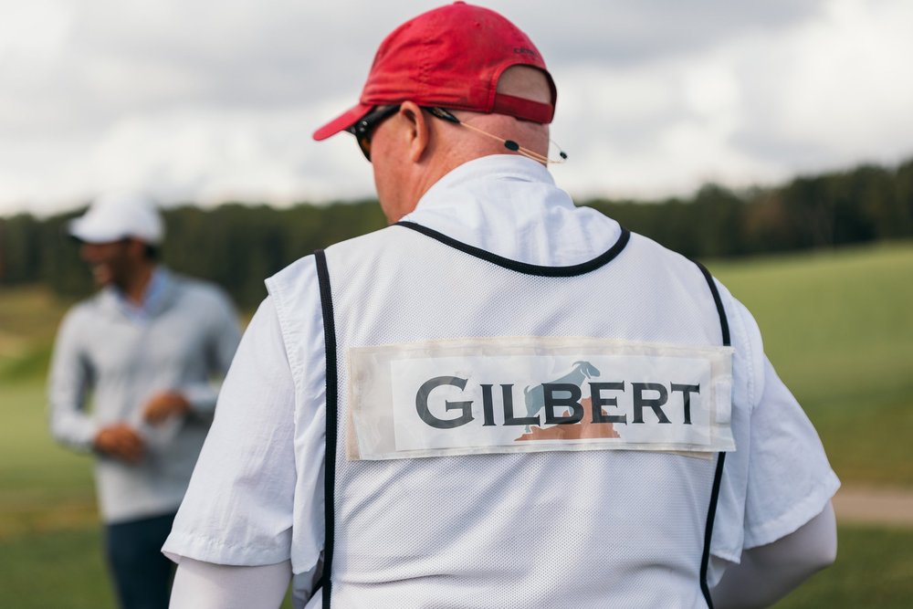  A caddie caddying for country-music singer, Brantley Gilbert with “Gilbert” written on his shirt. (Copy)