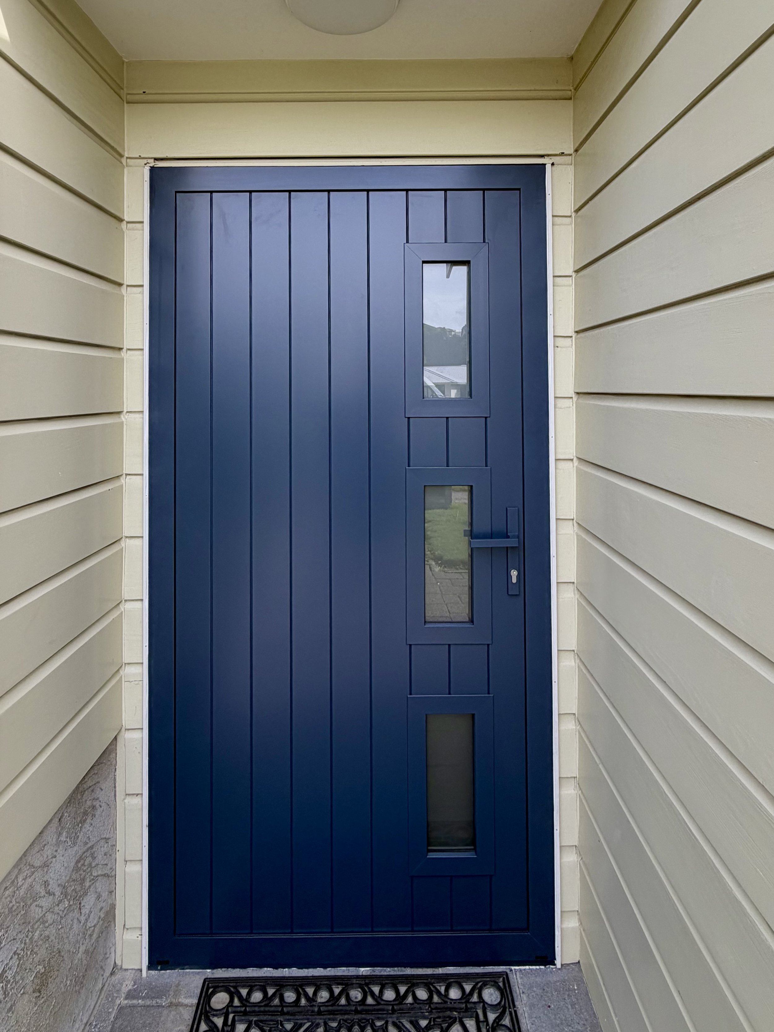 A New aluminium front door installed into a timber weatherboard house in Whitby