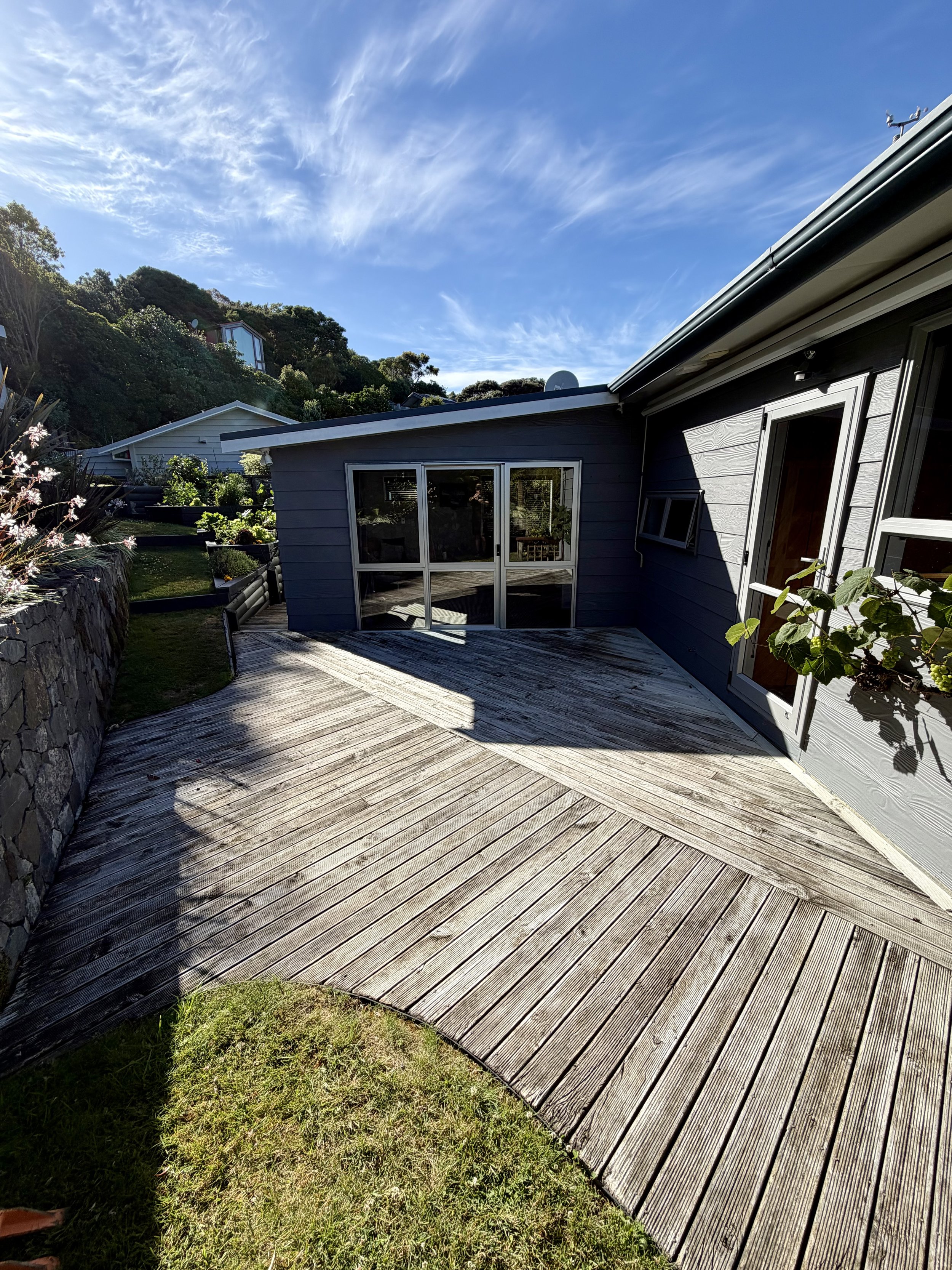 A old tired timber deck due for replacement in Plimmerton.