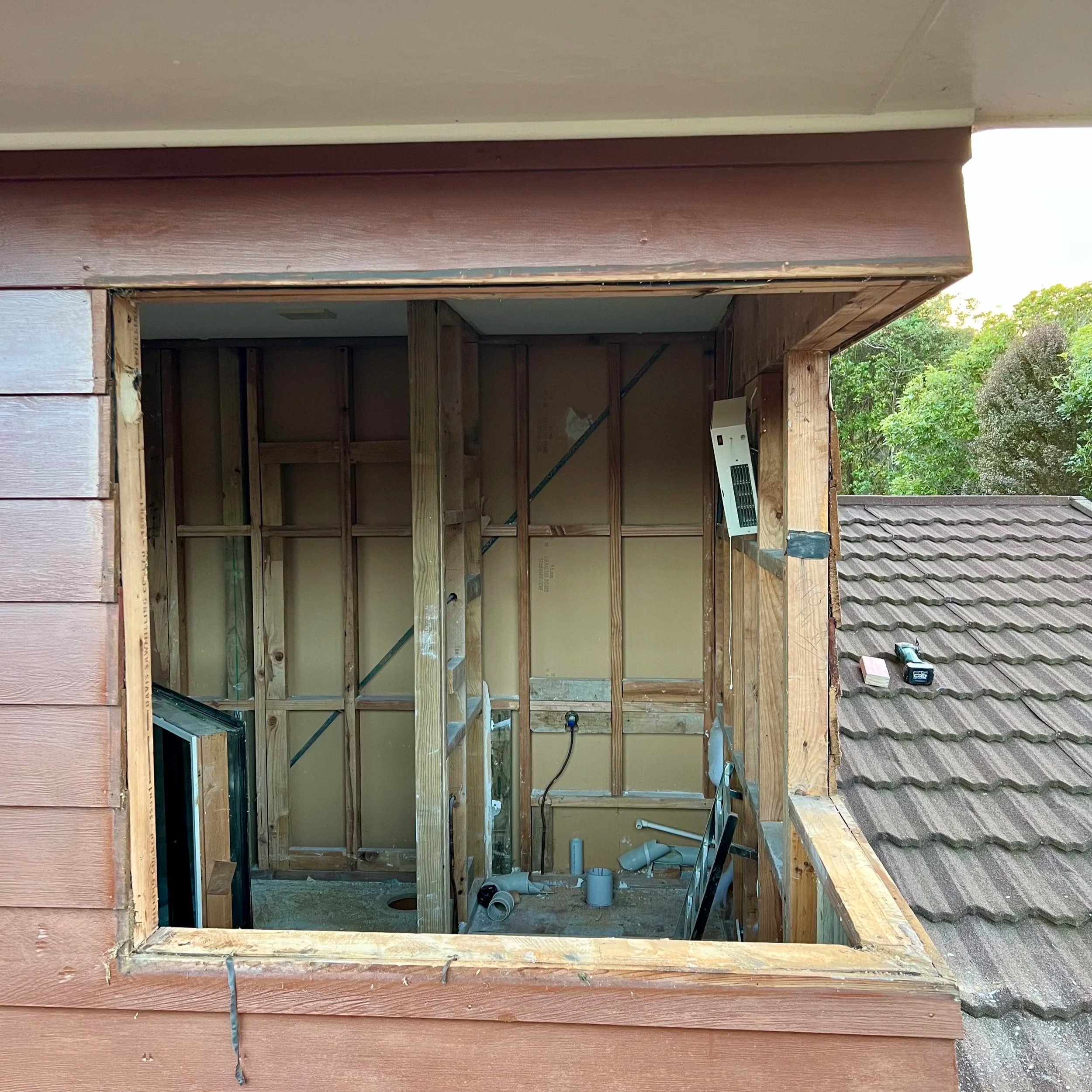 Construction site where a window has been removed.