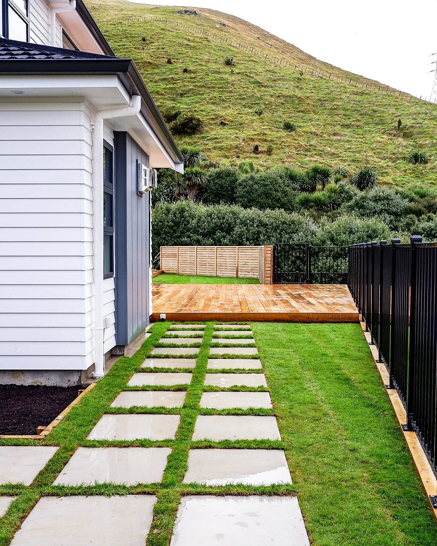 New build landscaping in Churton Park with timber decking, ready lawn and concrete paving