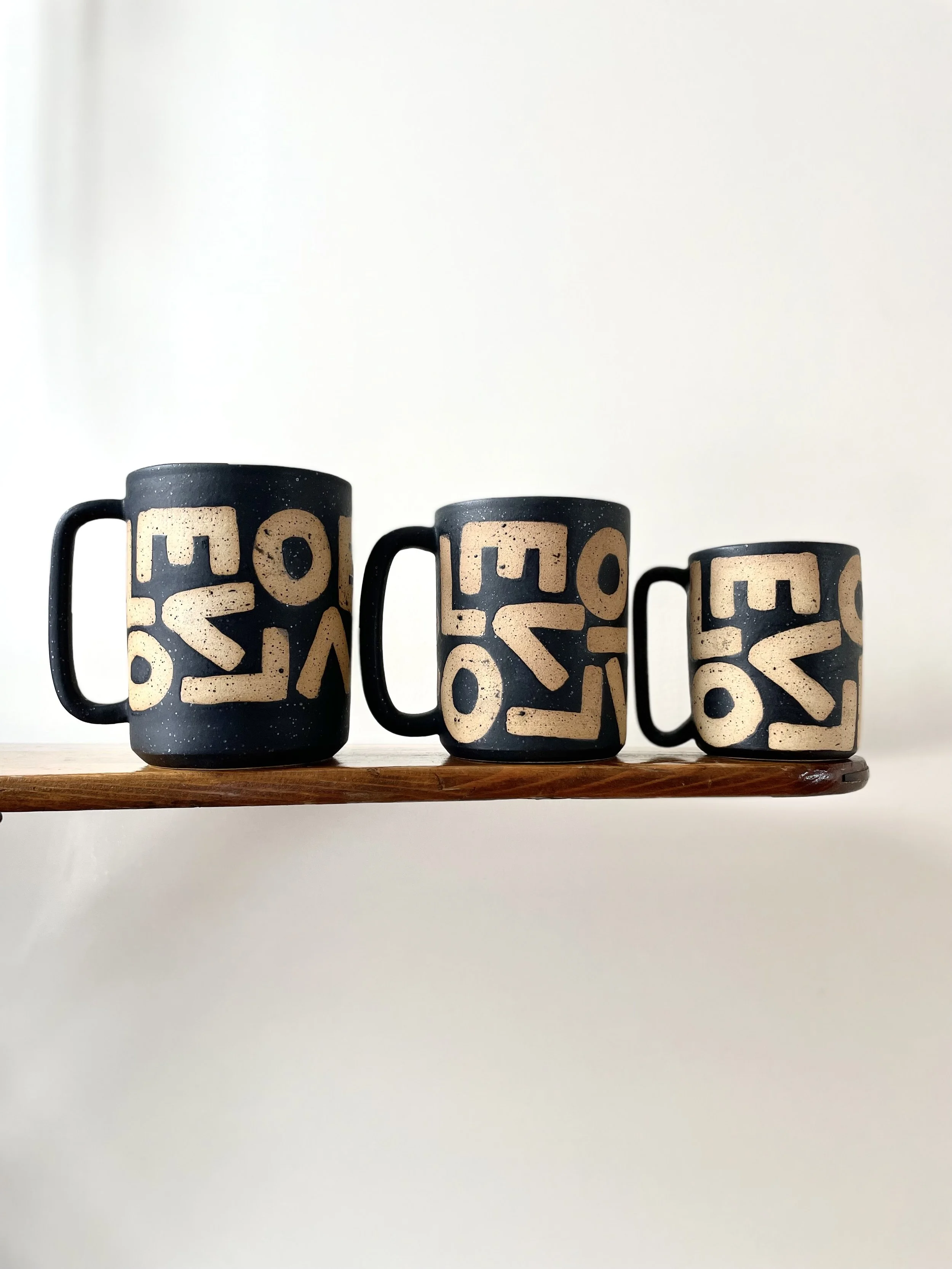 L-O-V-E Mug in speckled matte black, raw letters