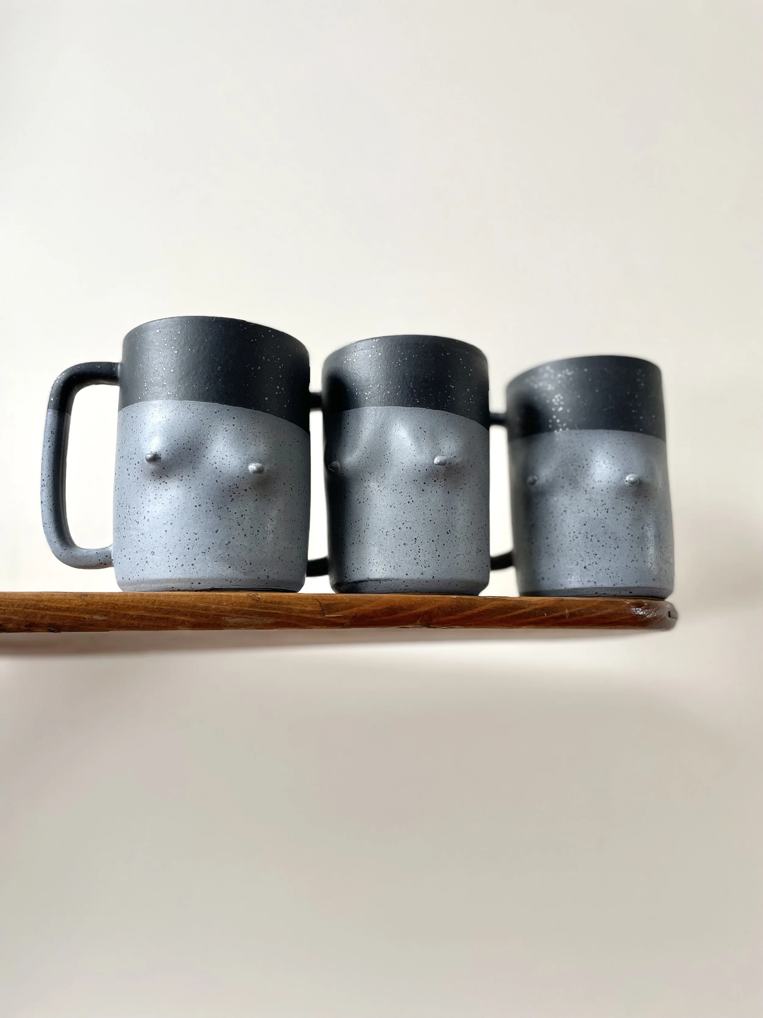 Speckled Matte Breast mug in Matte black, matte white, two-toned