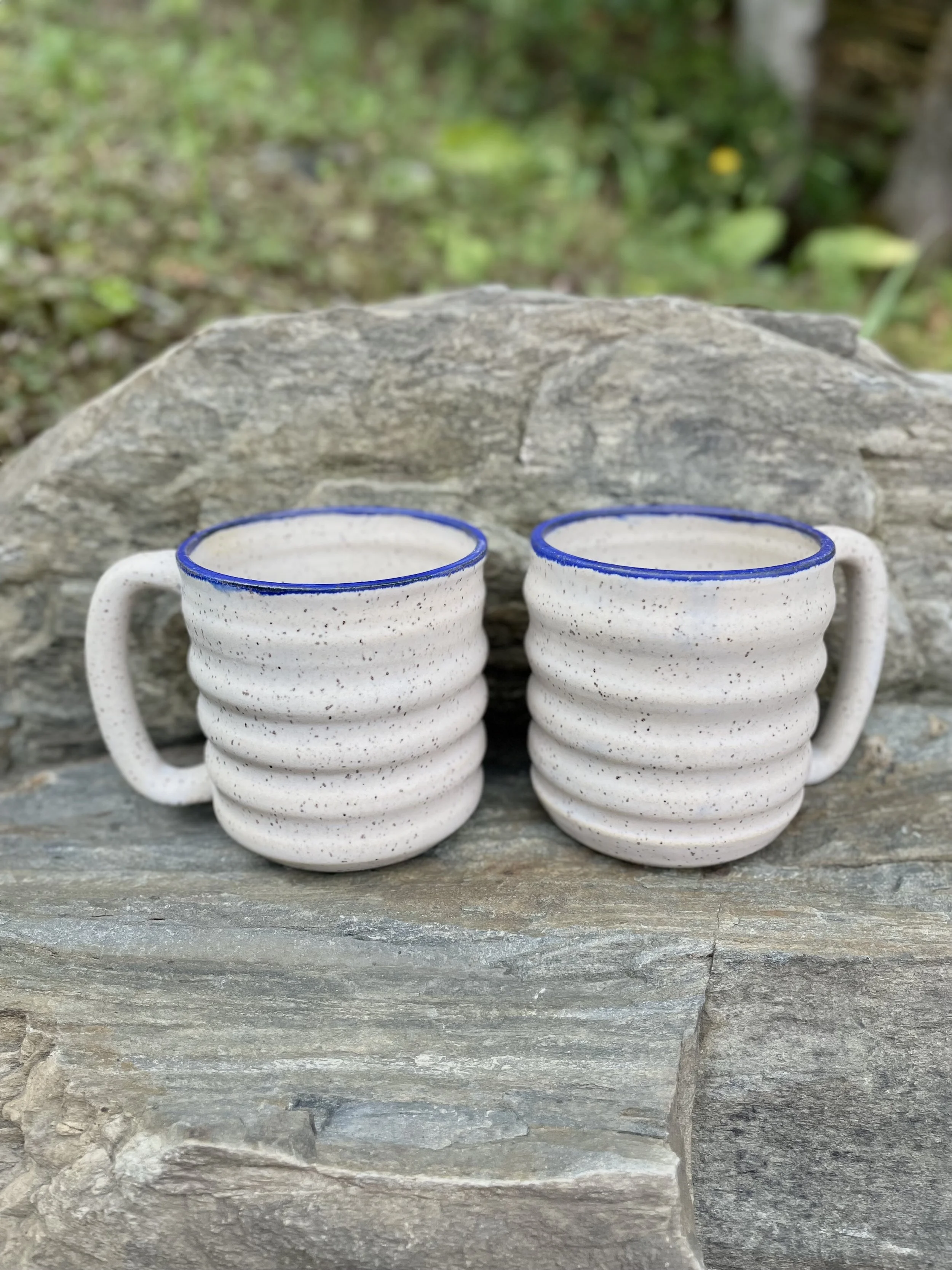 Matte white speckled carved mug
