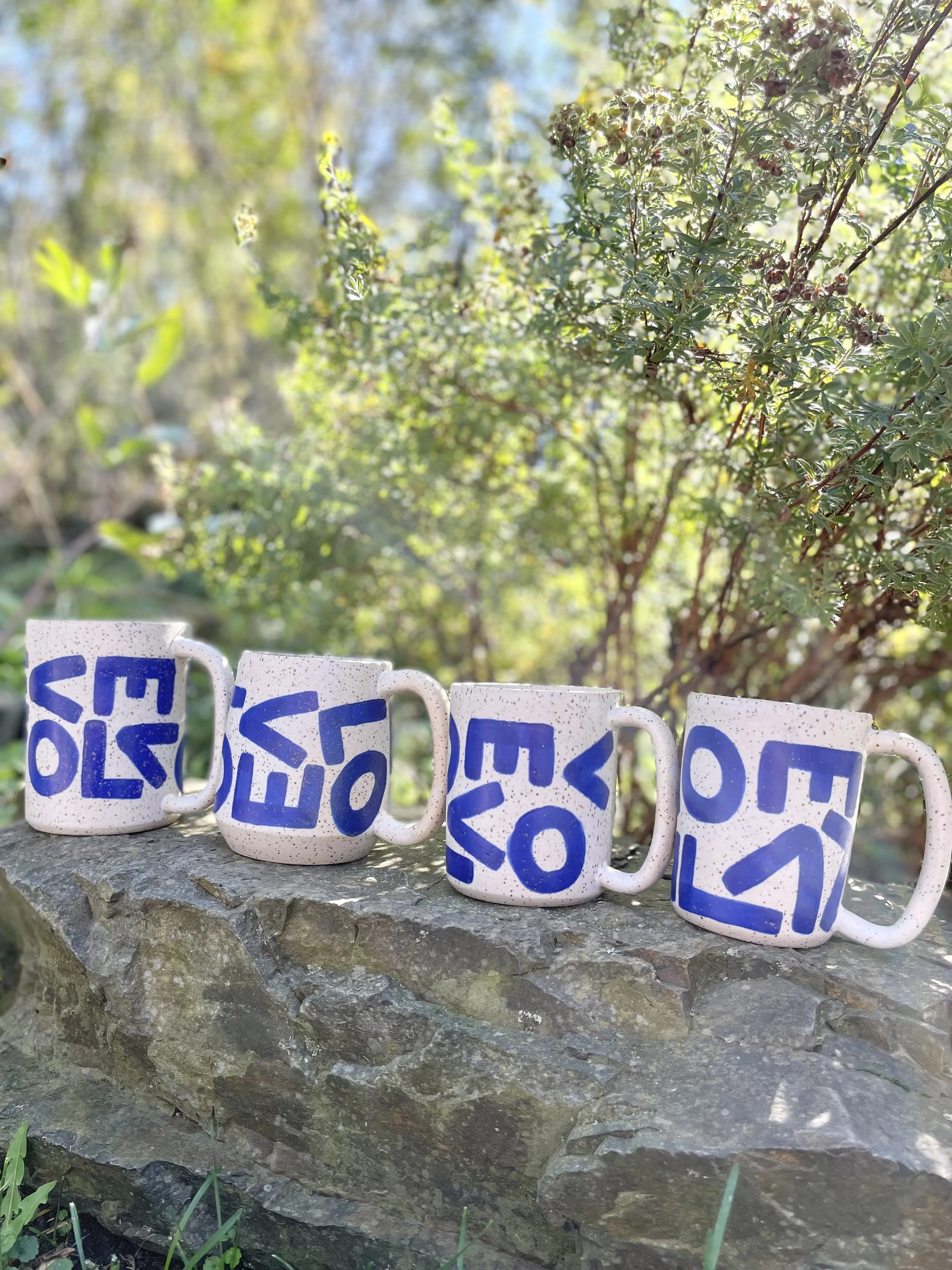 L-O-V-E Mug with cobalt blue letters, speckled matte white