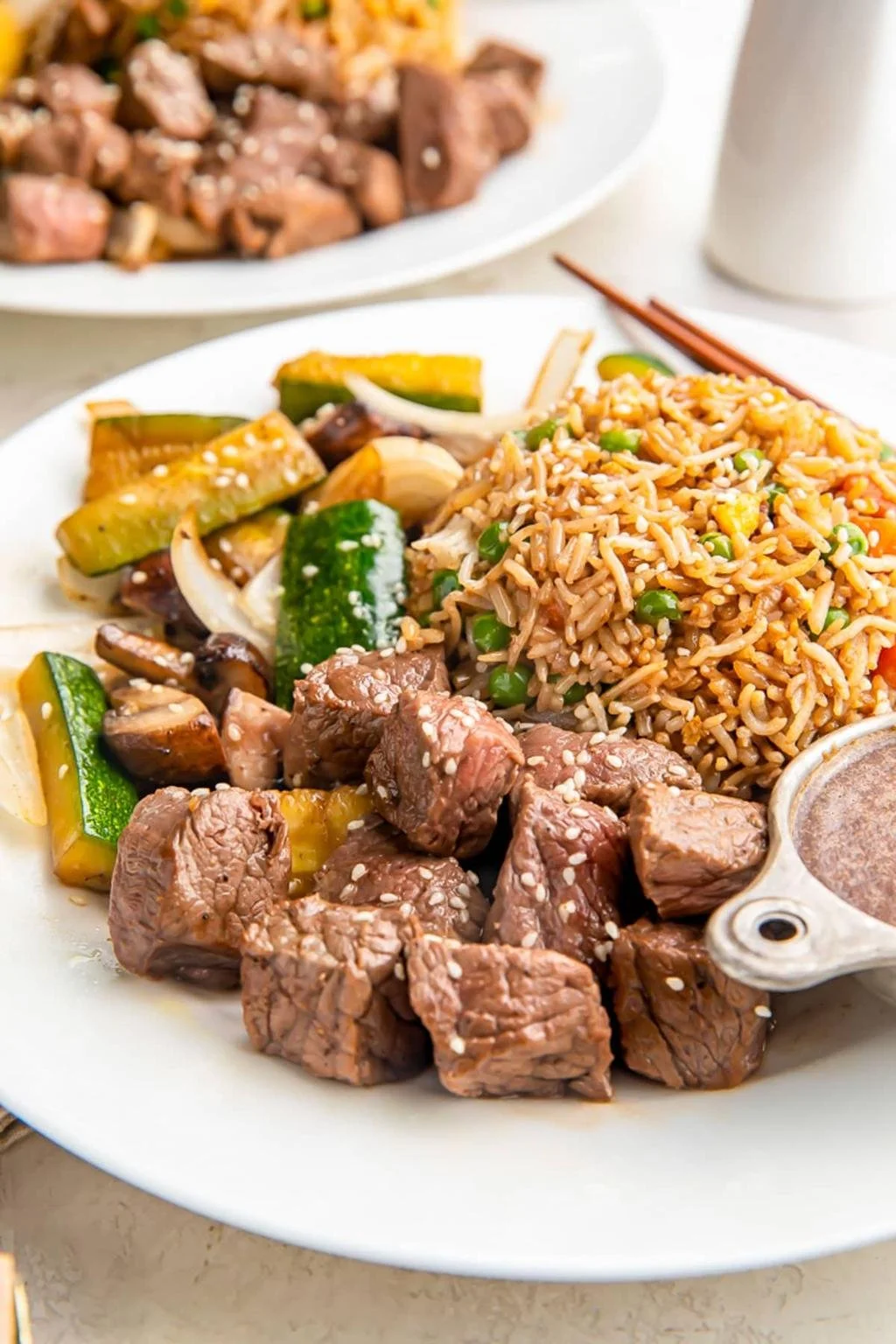 Teppanyaki New York steak served sizzling with vegetables in Japanese steakhouse style