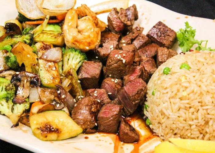 Filet mignon and shrimp teppanyaki combo served with rice and vegetables
