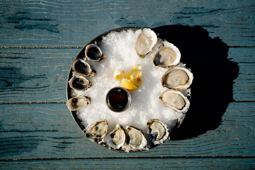 Oysters with lemon over ice.