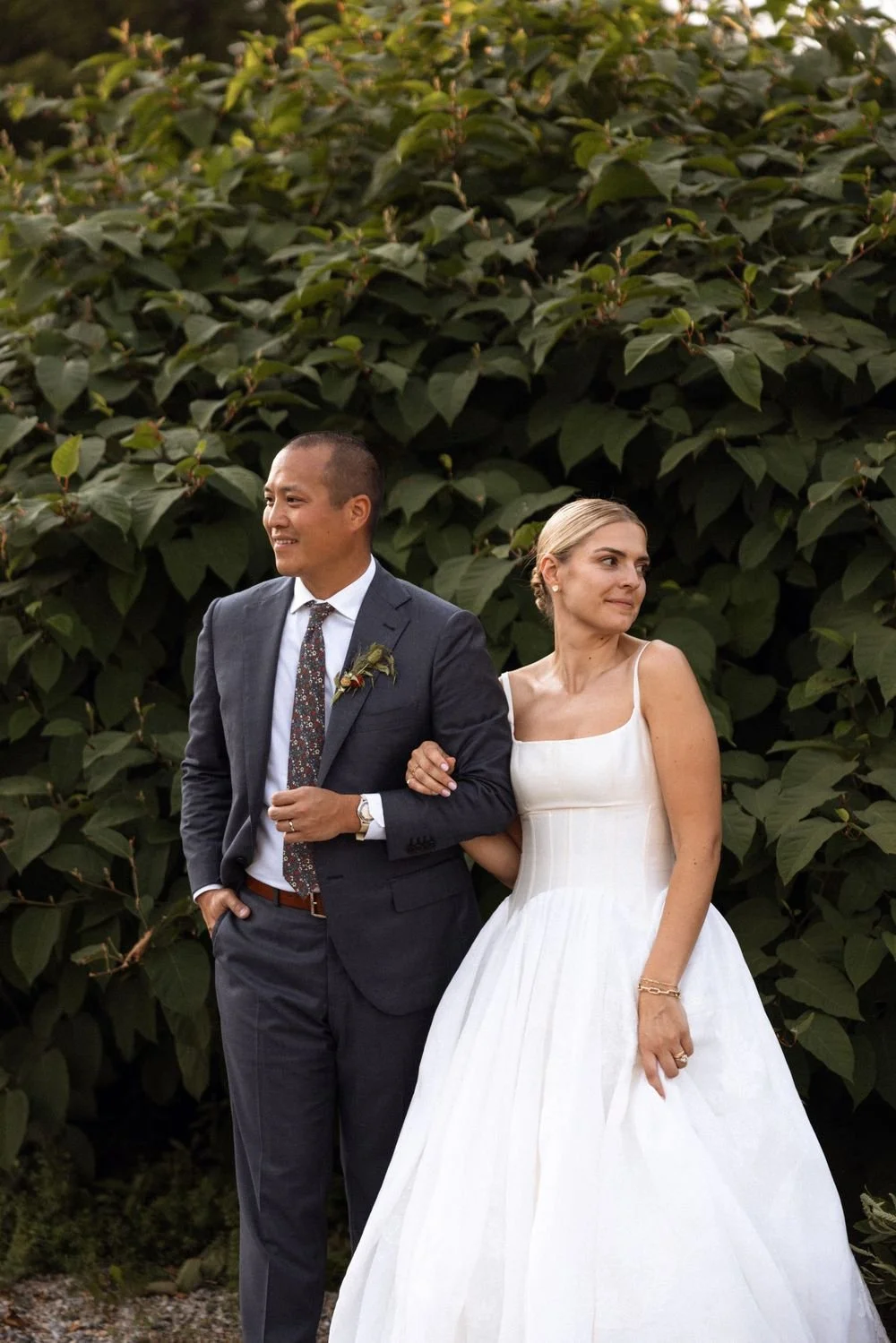 Wedding florals at The Henson, Hensonville, NY — gardeny red, creams, and greens with seasonal produce by Fiora floral design, Hudson Valley wedding florist.
