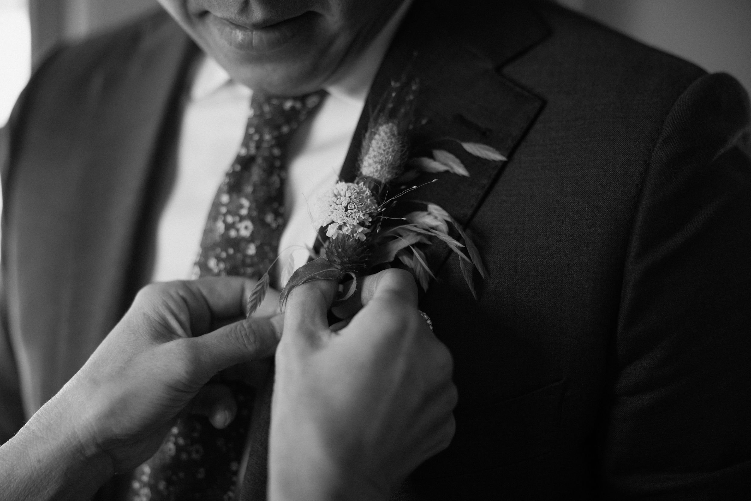 Wedding florals at The Henson, Hensonville, NY — gardeny red, creams, and greens with seasonal produce by Fiora floral design, Hudson Valley wedding florist.