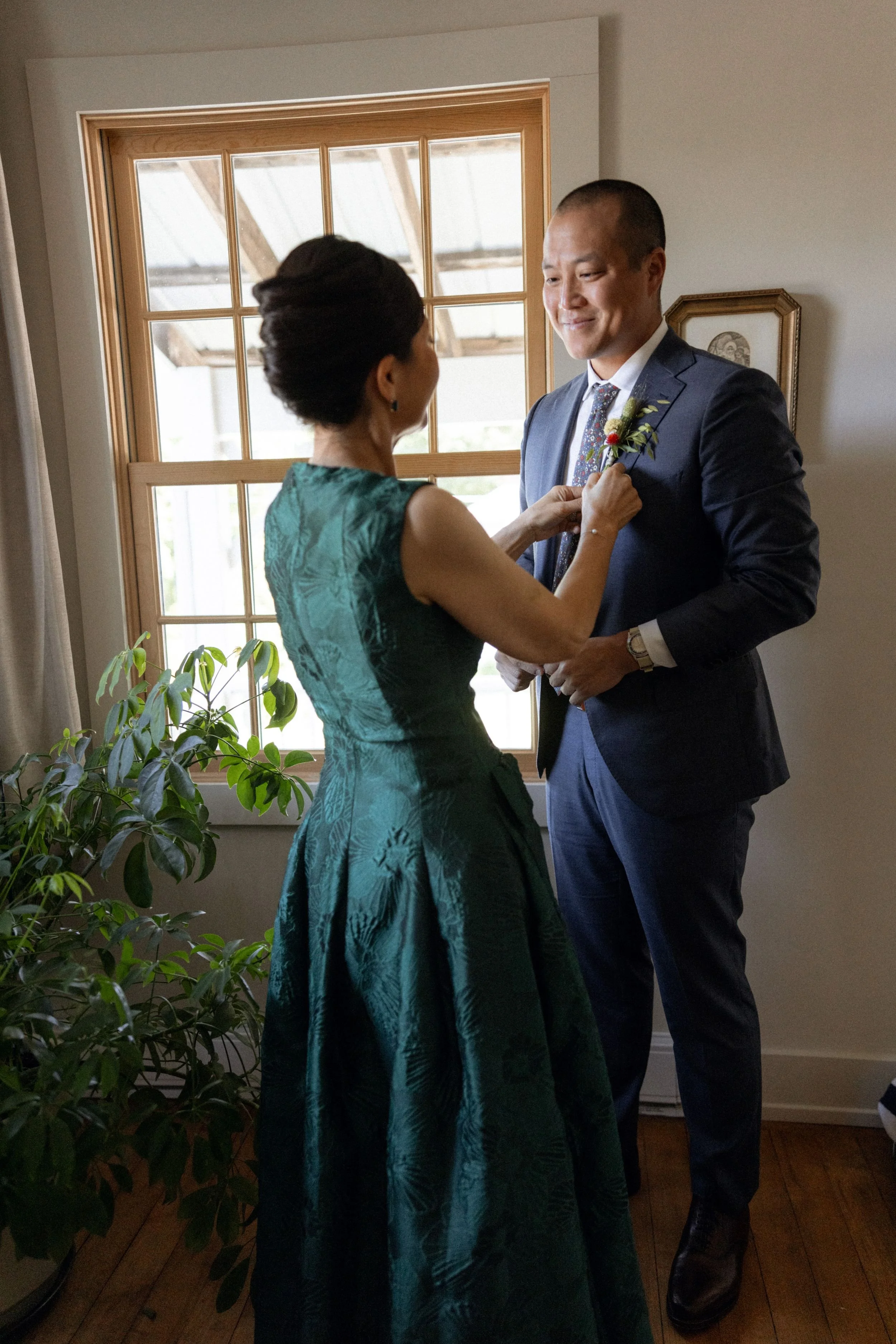 Wedding florals at The Henson, Hensonville, NY — gardeny red, creams, and greens with seasonal produce by Fiora floral design, Hudson Valley wedding florist.