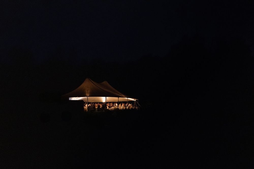 Wedding florals at The Henson, Hensonville, NY — gardeny red, creams, and greens with seasonal produce by Fiora floral design, Hudson Valley wedding florist.