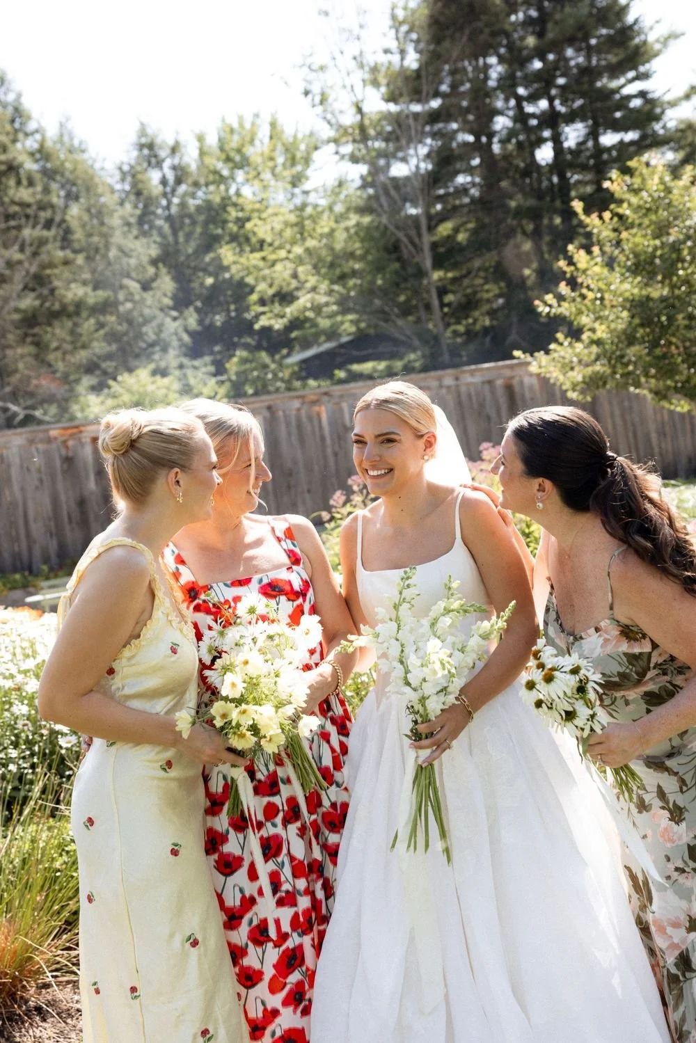 Wedding florals at The Henson, Hensonville, NY — gardeny red, creams, and greens with seasonal produce by Fiora floral design, Hudson Valley wedding florist.