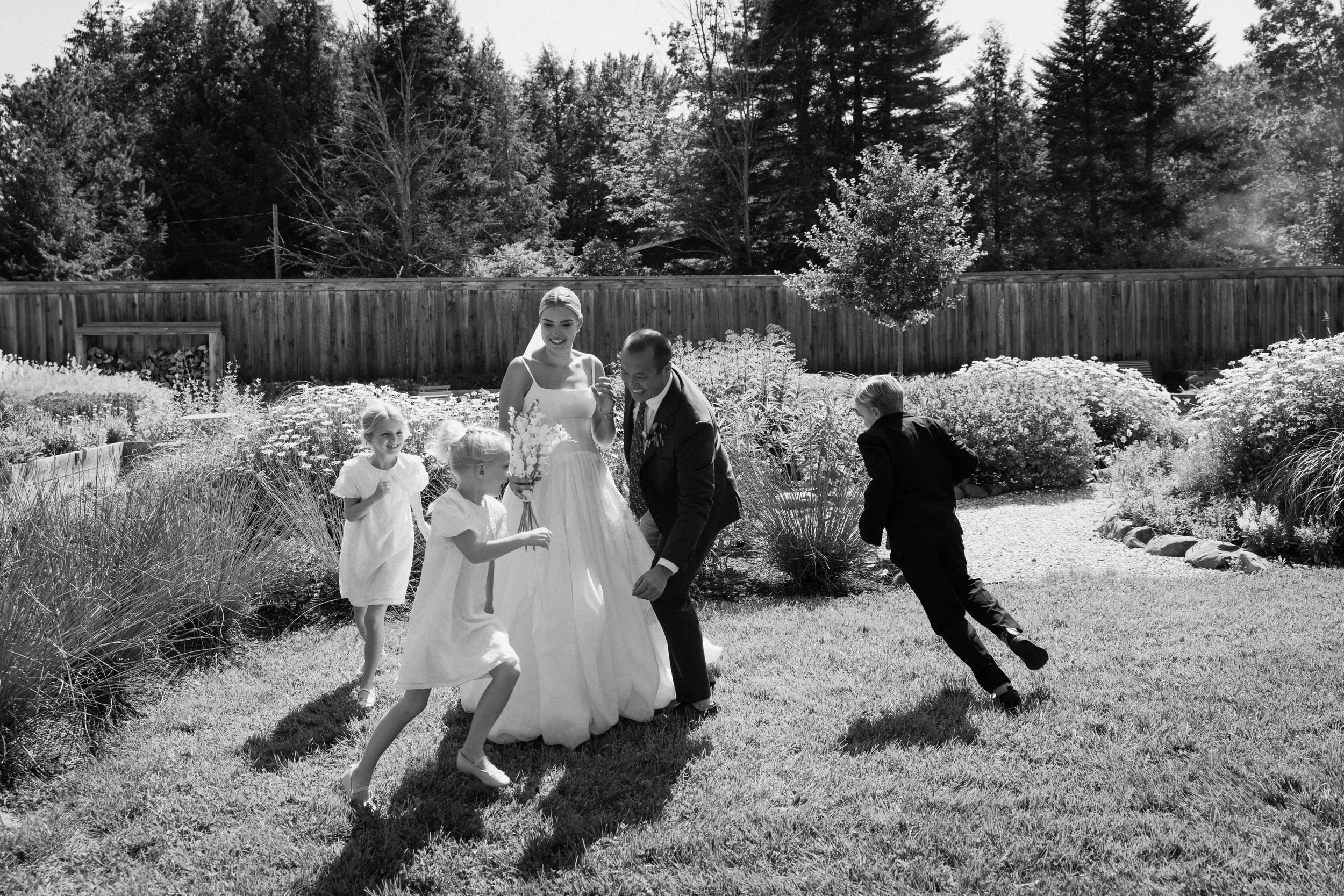 Wedding florals at The Henson, Hensonville, NY — gardeny red, creams, and greens with seasonal produce by Fiora floral design, Hudson Valley wedding florist.