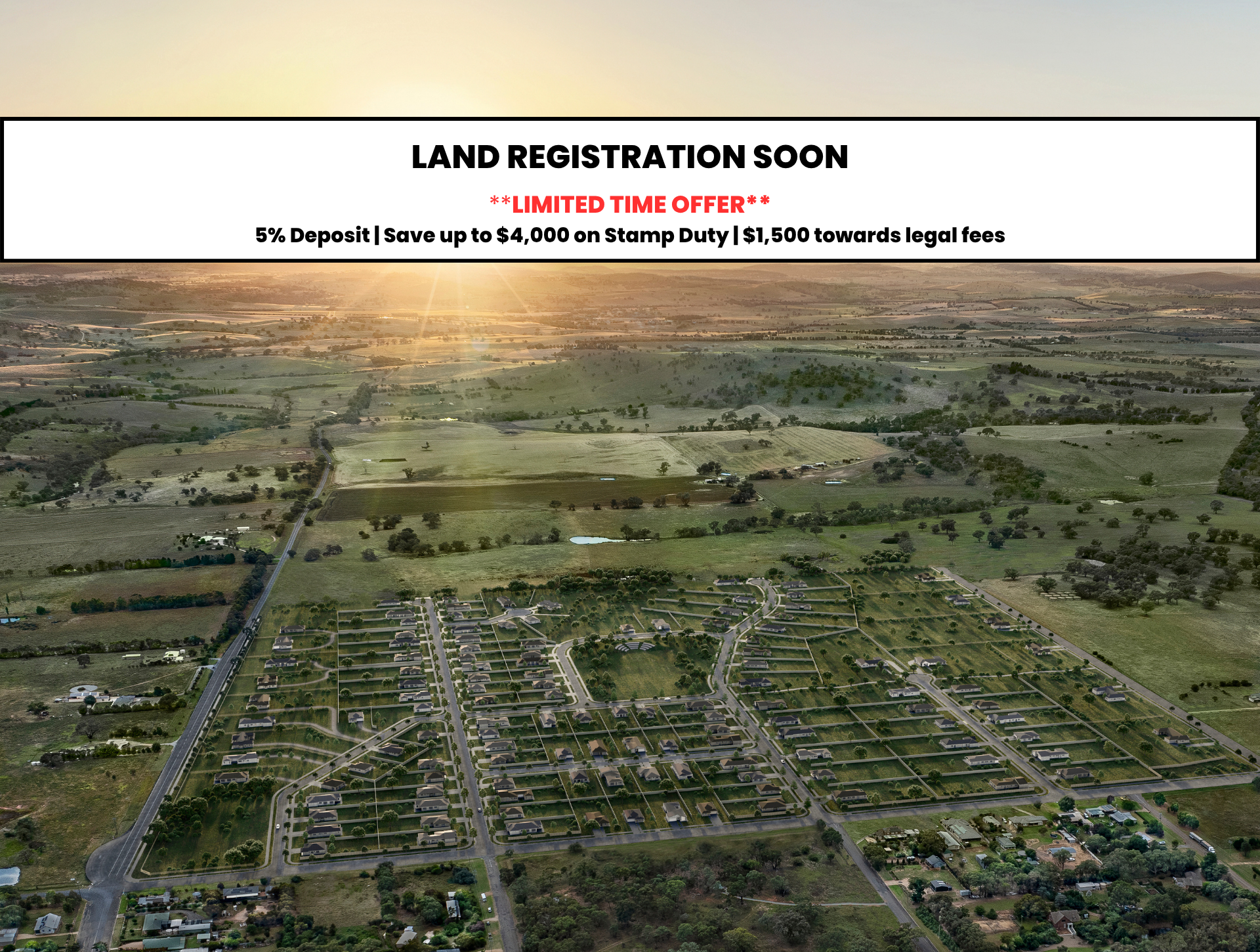 An aerial view of a residential neighborhood with houses and streets surrounded by green fields and farmland at sunset.