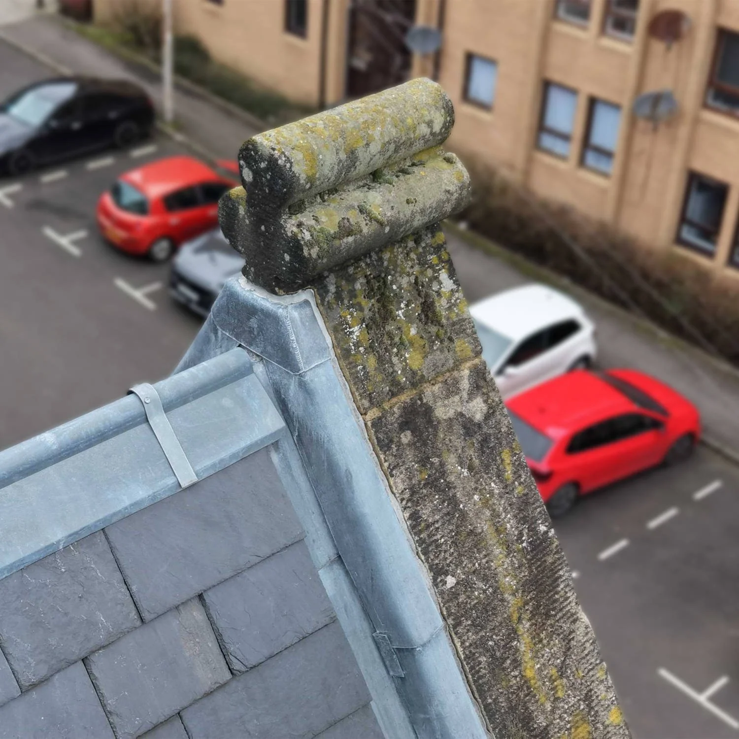 drone inspecting a carved stone feature on a pediment
