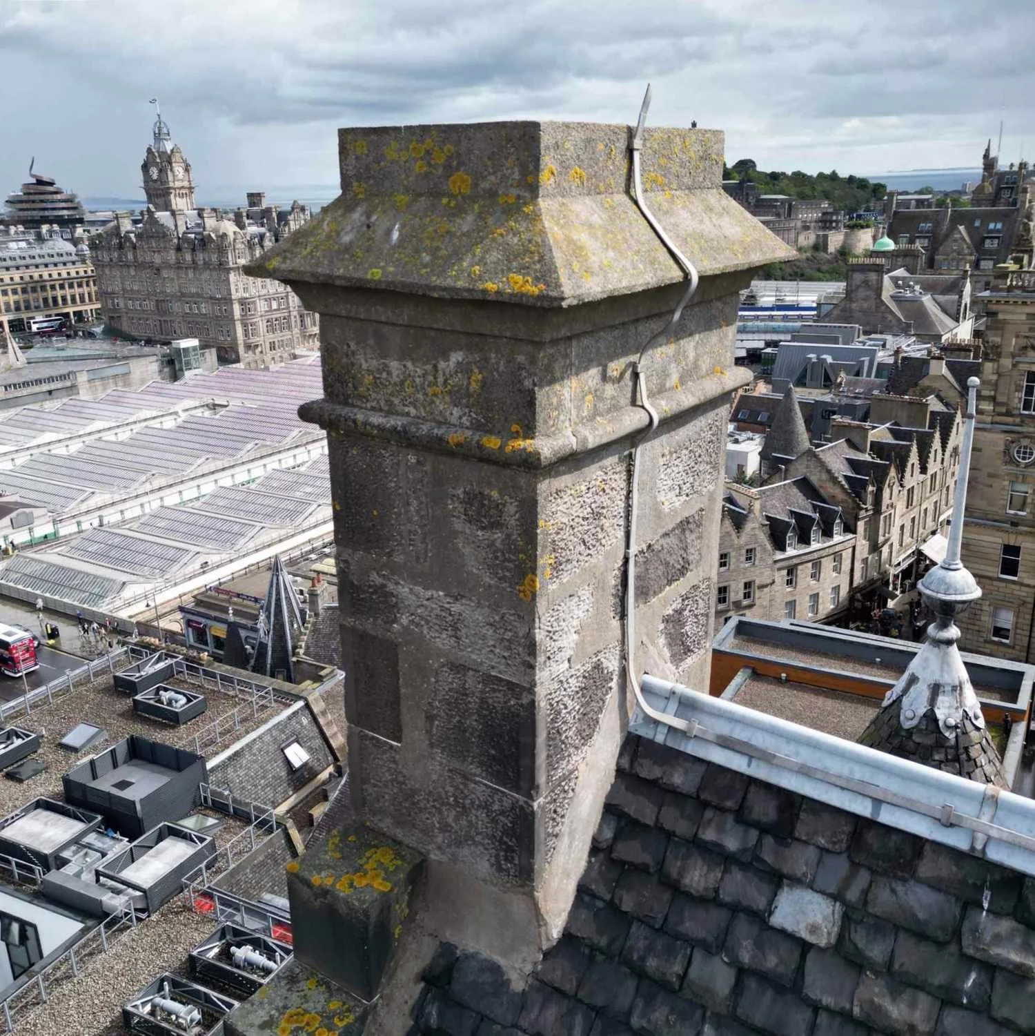 drone inspecting a chimney on a city centre historic building